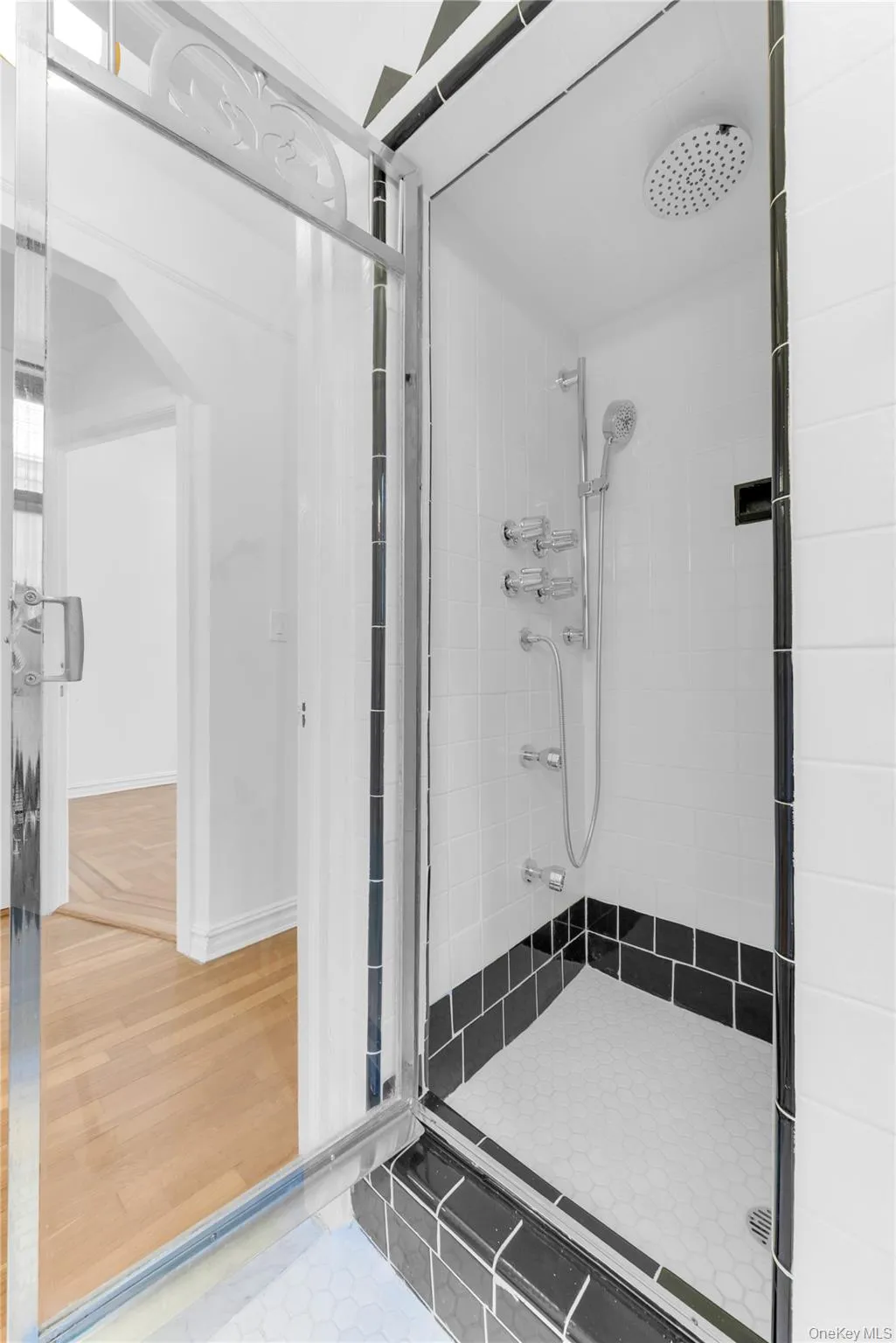 Upper level full bathroom with separate standing shower with full body spa nozzels Upper level full bathroom with separate standing shower with full body spa nozzels