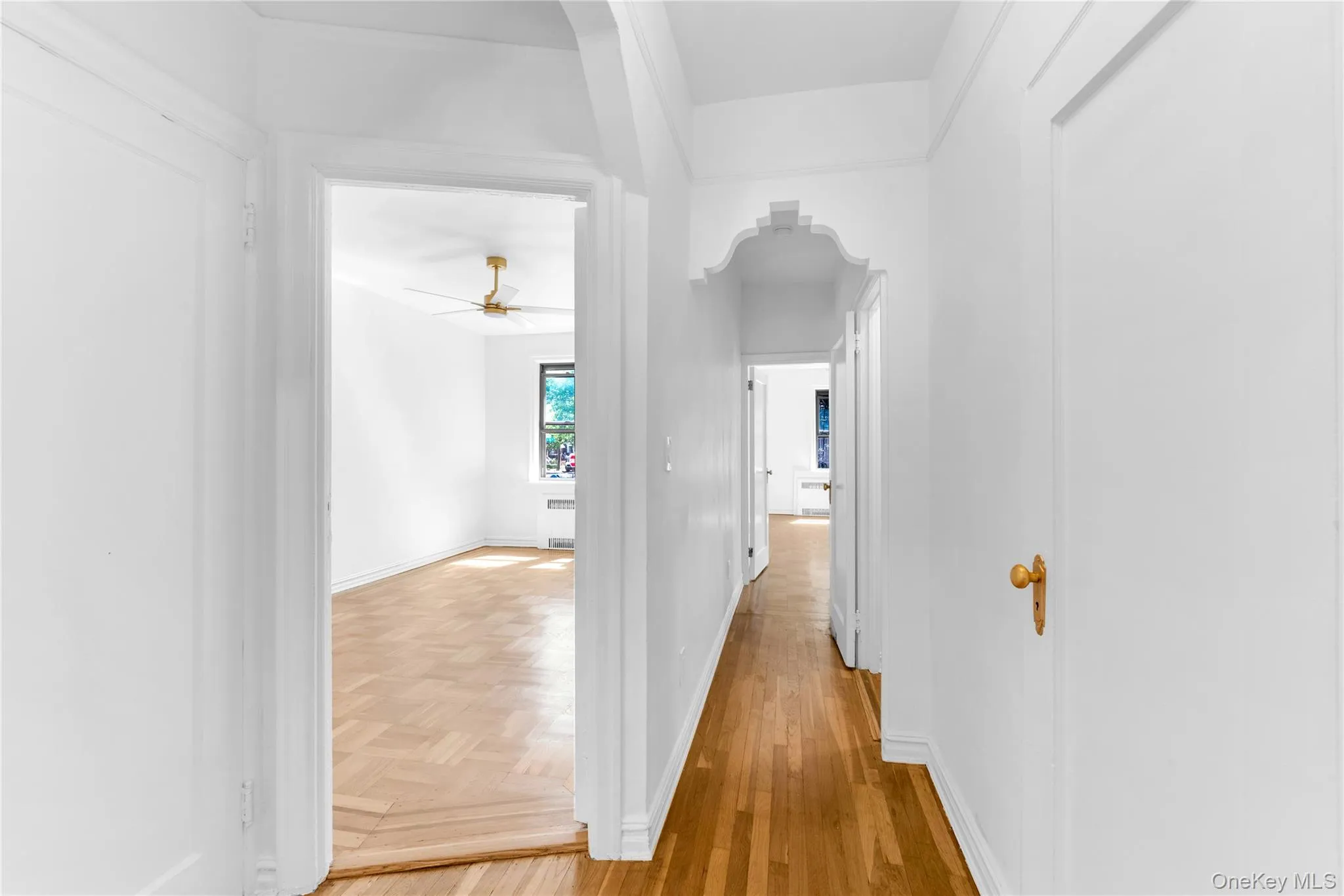 Upper level hallway with original decorative doorway cut-outs Upper level hallway with original decorative doorway cut-outs