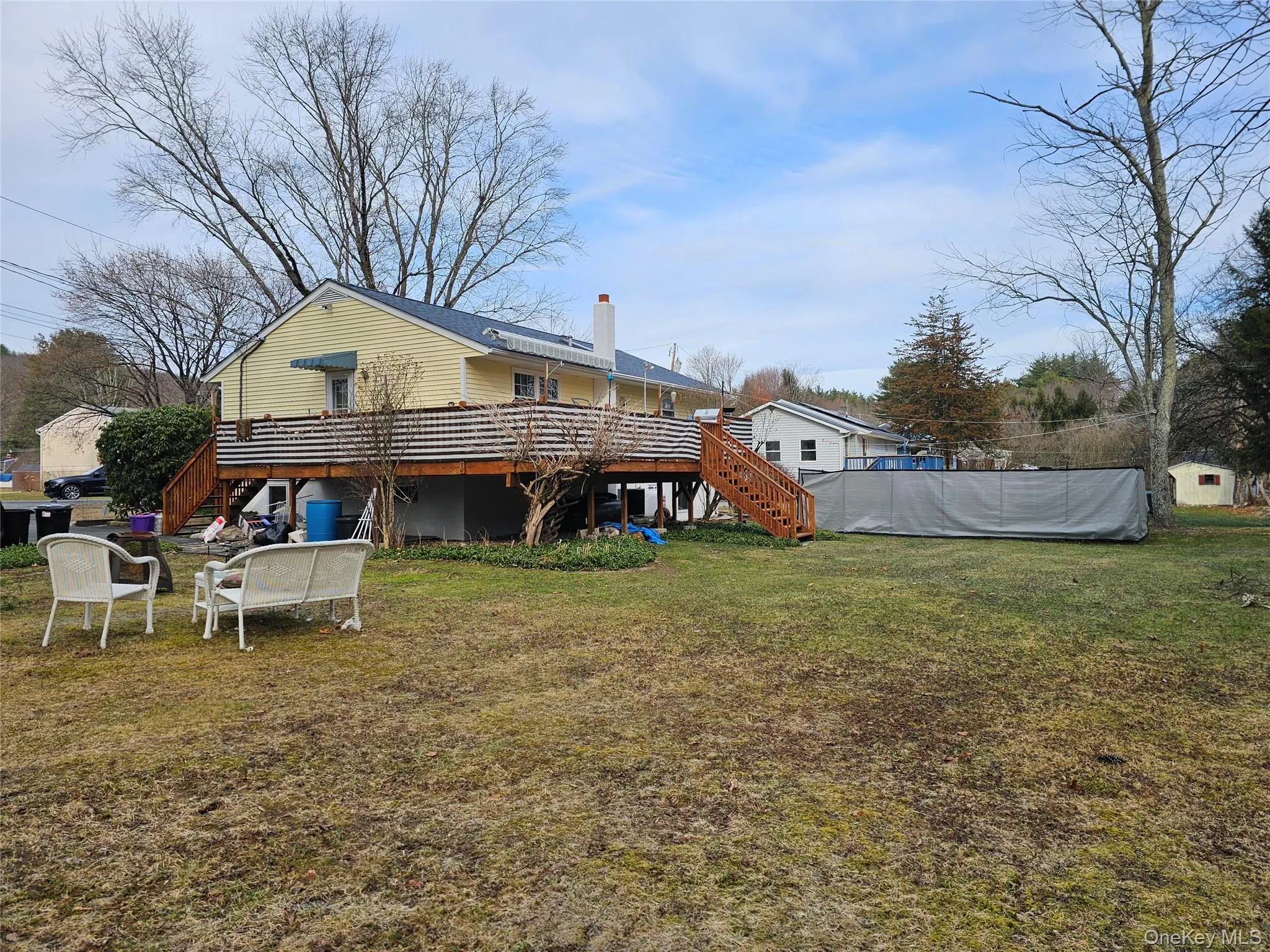 View of yard featuring a wooden deck View of yard featuring a wooden deck