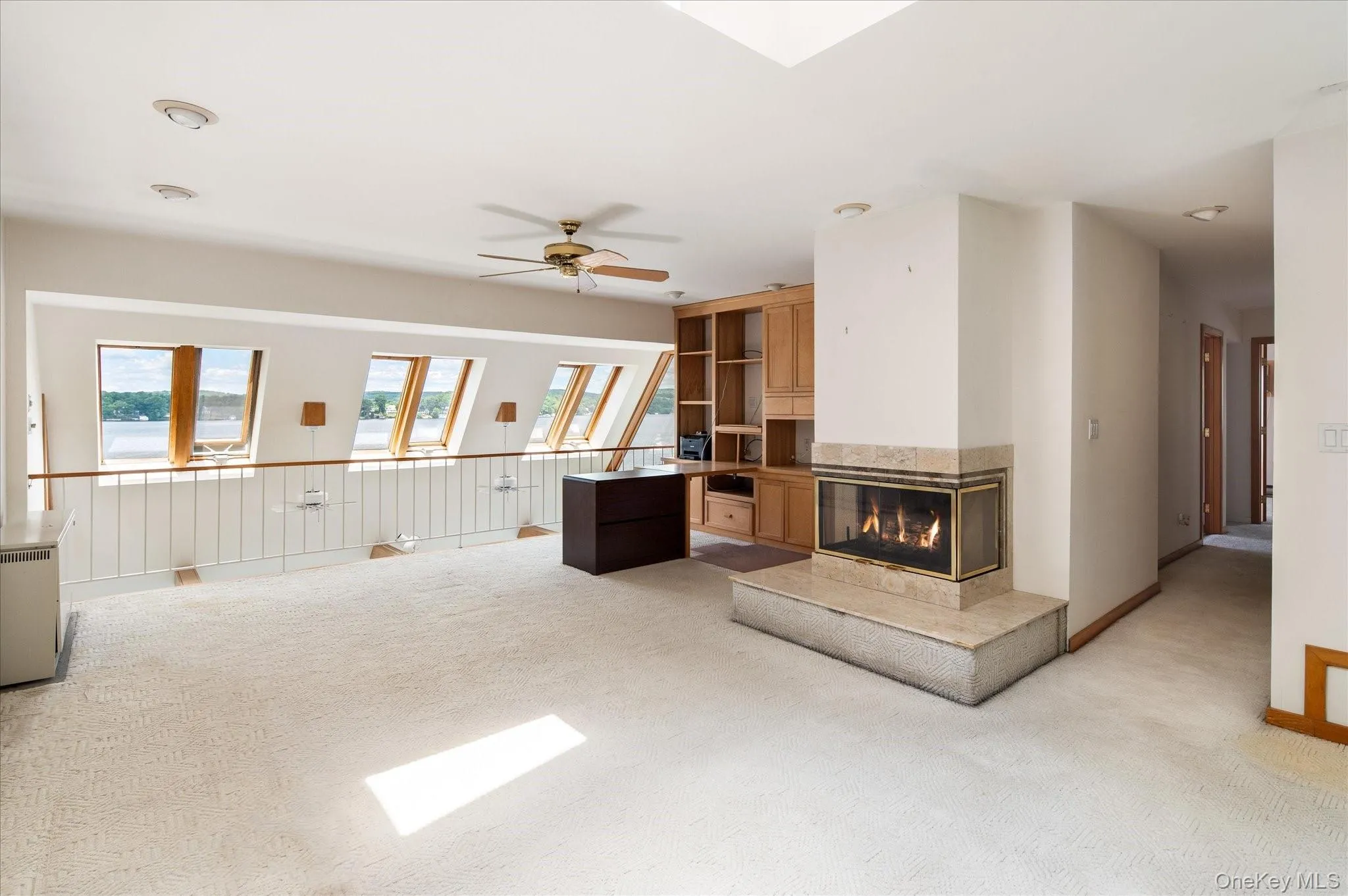 The third floor bonus room with fireplace, wet bar, and skylights overlooking Lake Mahopac The third floor bonus room with fireplace, wet bar, and skylights overlooking Lake Mahopac