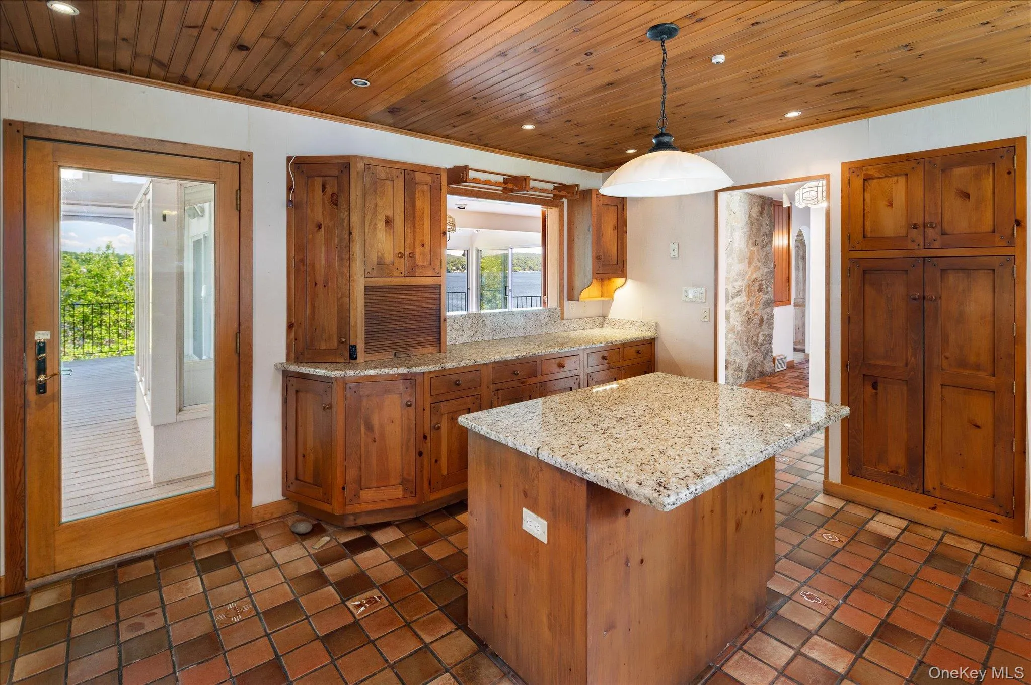 Custom cabinetry, granite countertops, and a farmhouse sink in this Lake Mahopac waterfront home Custom cabinetry, granite countertops, and a farmhouse sink in this Lake Mahopac waterfront home