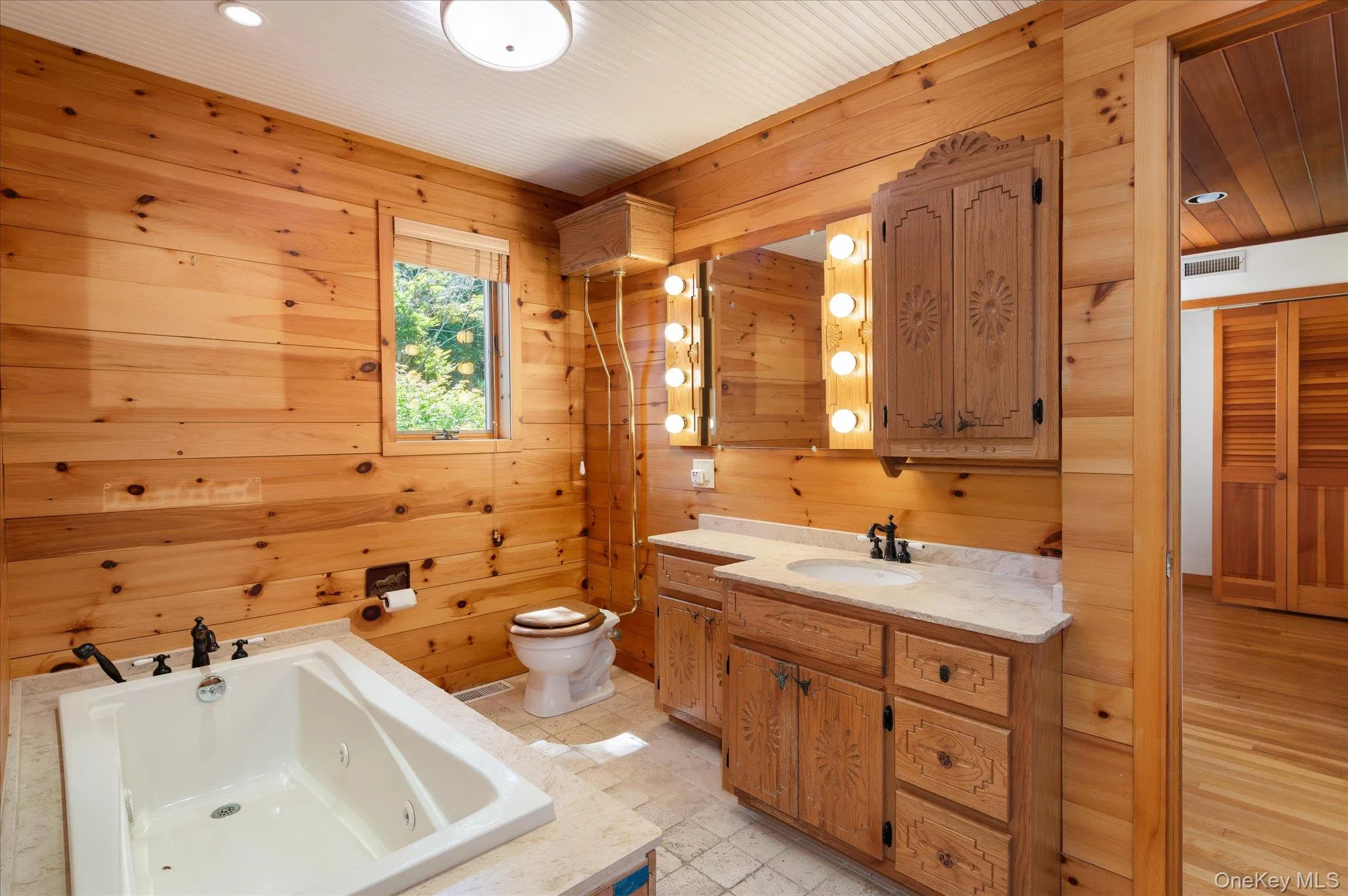 The primary ensuite bath in this Lake Mahopac waterfront home The primary ensuite bath in this Lake Mahopac waterfront home