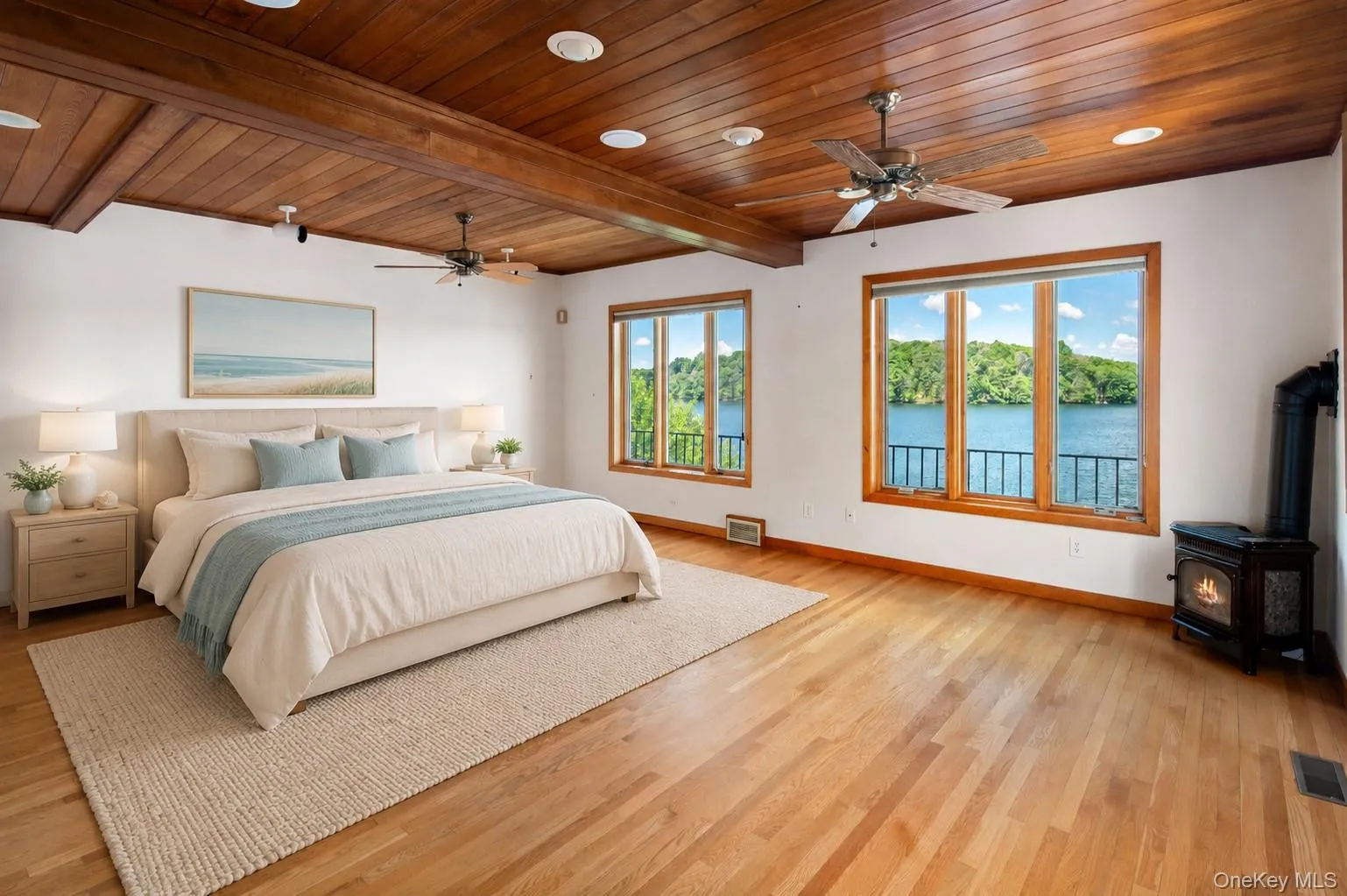 Wake up to the lake every morning in this main level primary suite (digitally staged) Wake up to the lake every morning in this main level primary suite (digitally staged)