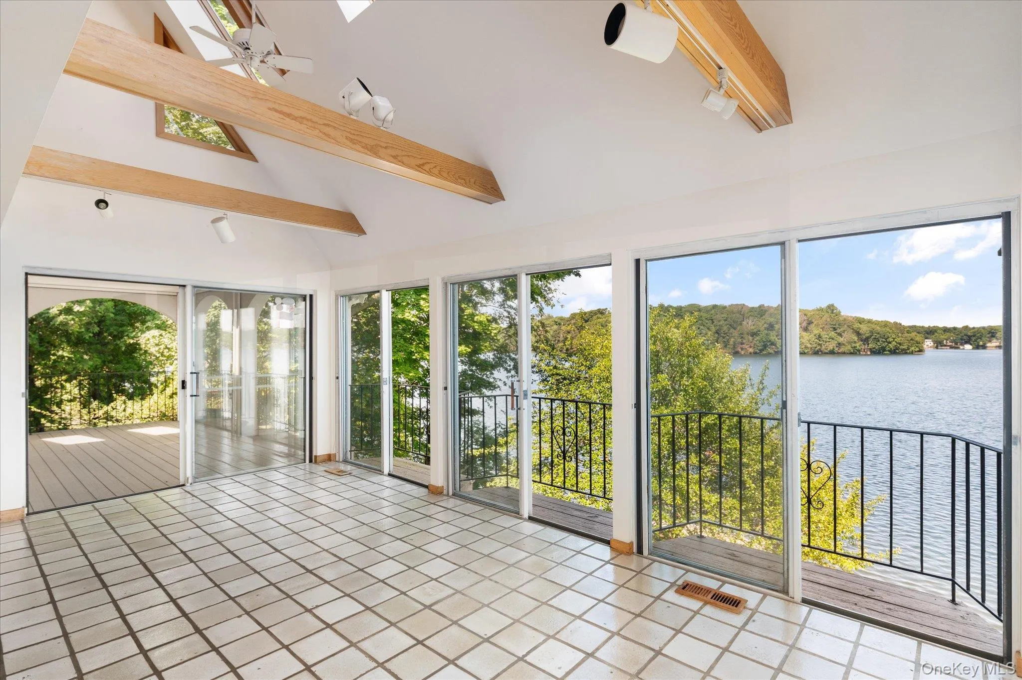 Open, light-filled living with Lake Mahopac always in view Open, light-filled living with Lake Mahopac always in view