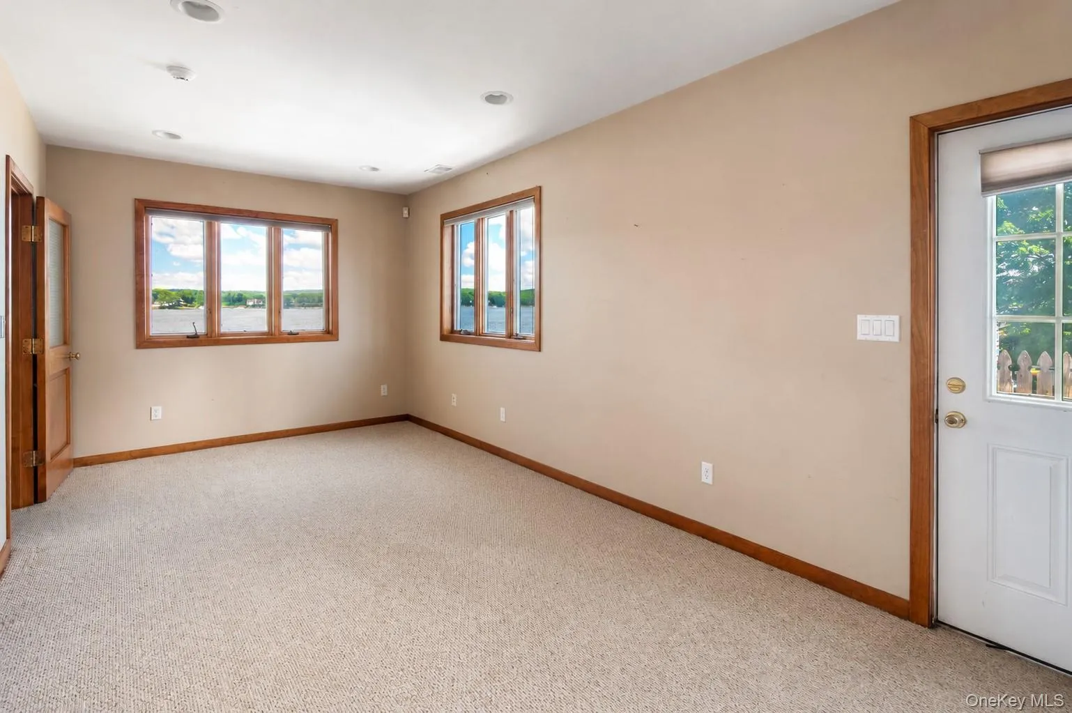 Direct outdoor access and lake views from the lower level of this Lake Mahopac waterfront home Direct outdoor access and lake views from the lower level of this Lake Mahopac waterfront home