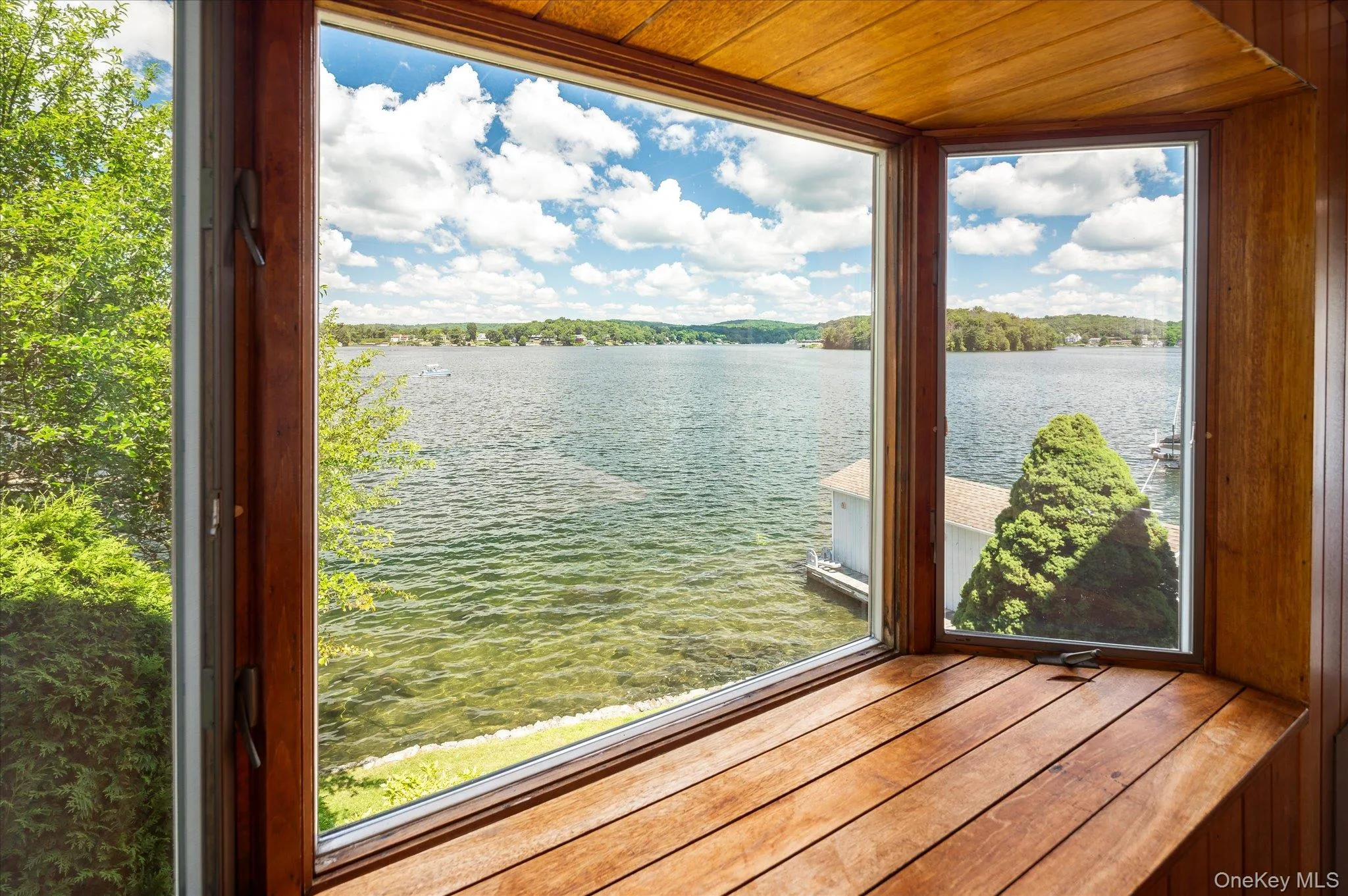 The lower level surprises with a bay window and sweeping open water views on Lake Mahopac The lower level surprises with a bay window and sweeping open water views on Lake Mahopac