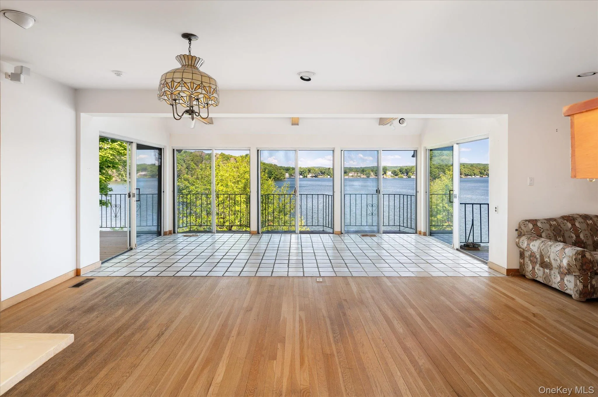Step inside and the lake takes over. Open water views from the main level great room Step inside and the lake takes over. Open water views from the main level great room