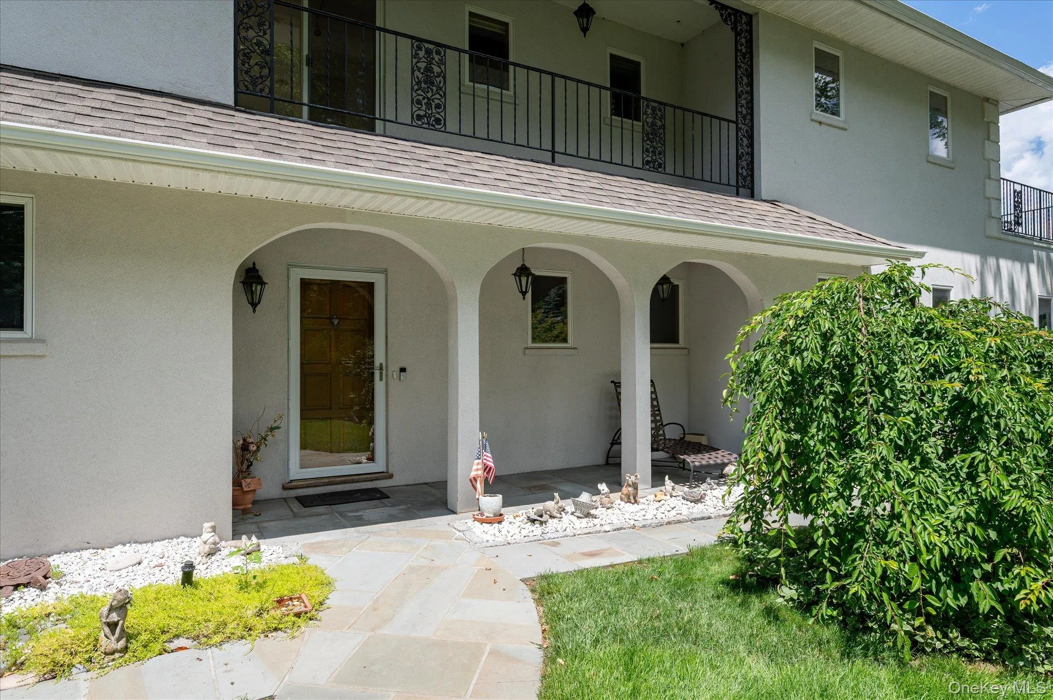 The arched entry portico and heated paver driveway set the tone from the moment you arrive The arched entry portico and heated paver driveway set the tone from the moment you arrive