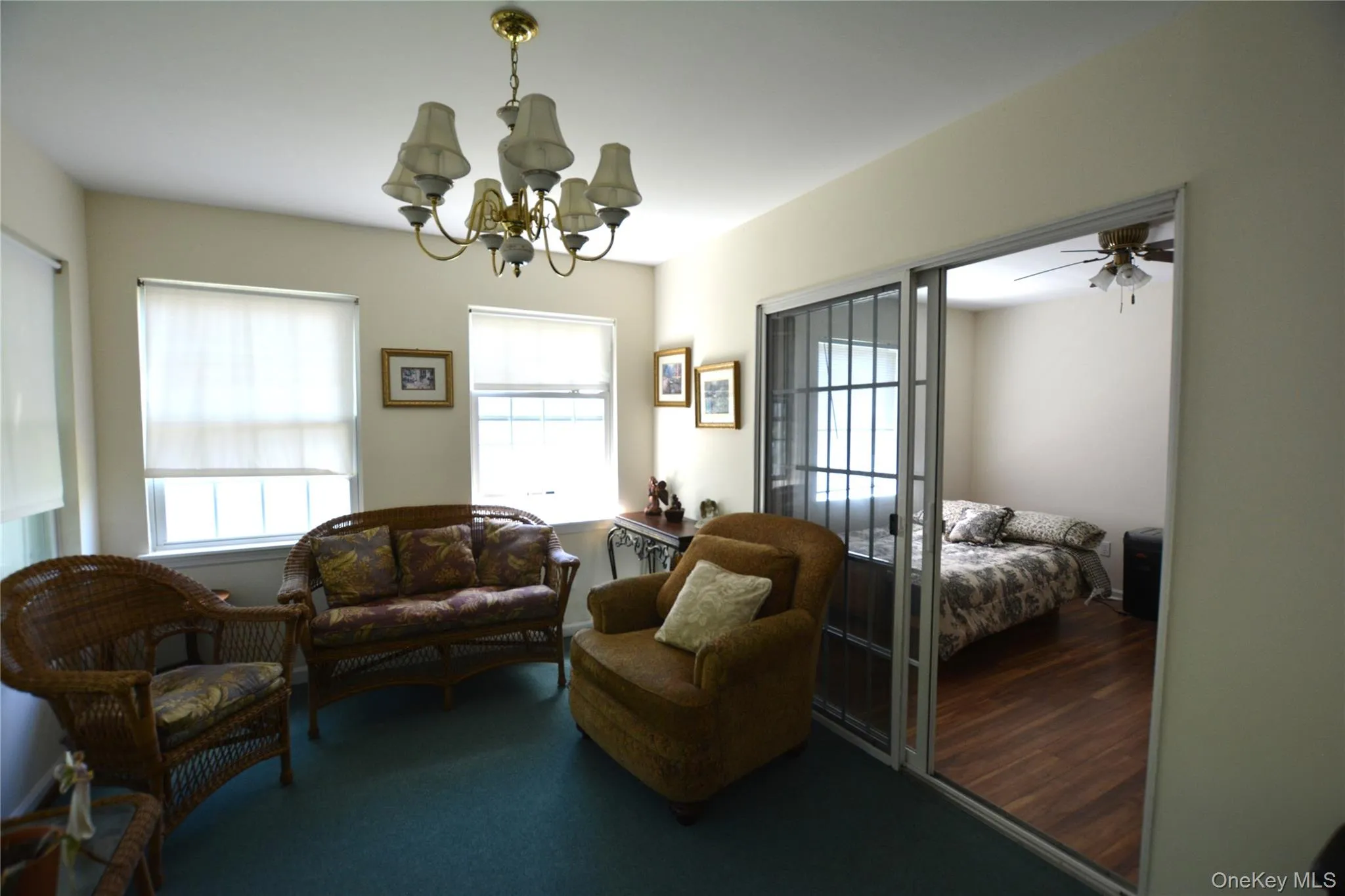Bonus room with patio doors leading to 2nd bedroom and door to backyard Bonus room with patio doors leading to 2nd bedroom and door to backyard
