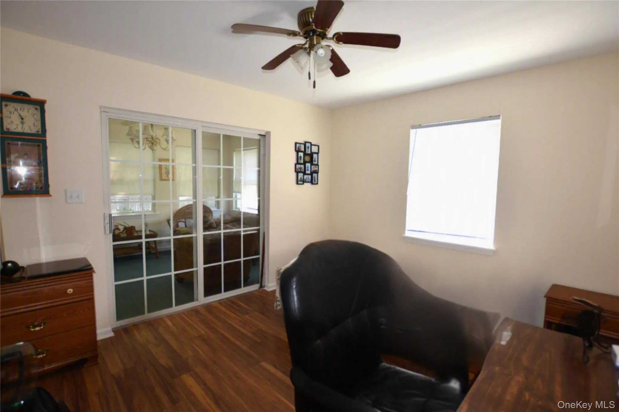 Second bedroom with patio doors leading to bonus room Second bedroom with patio doors leading to bonus room