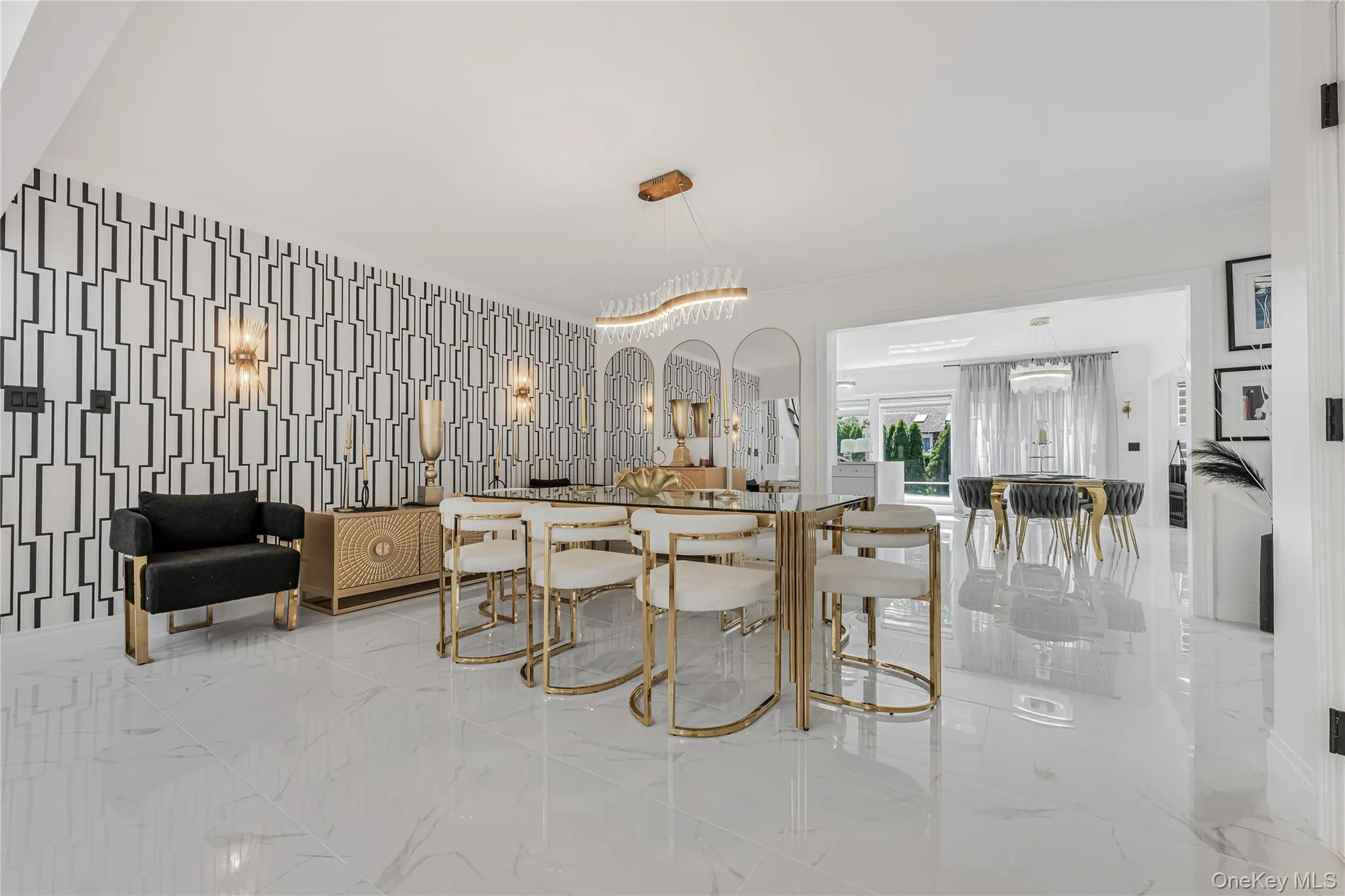 Dining room featuring marble tiled floors and crown molding Dining room featuring marble tiled floors and crown molding