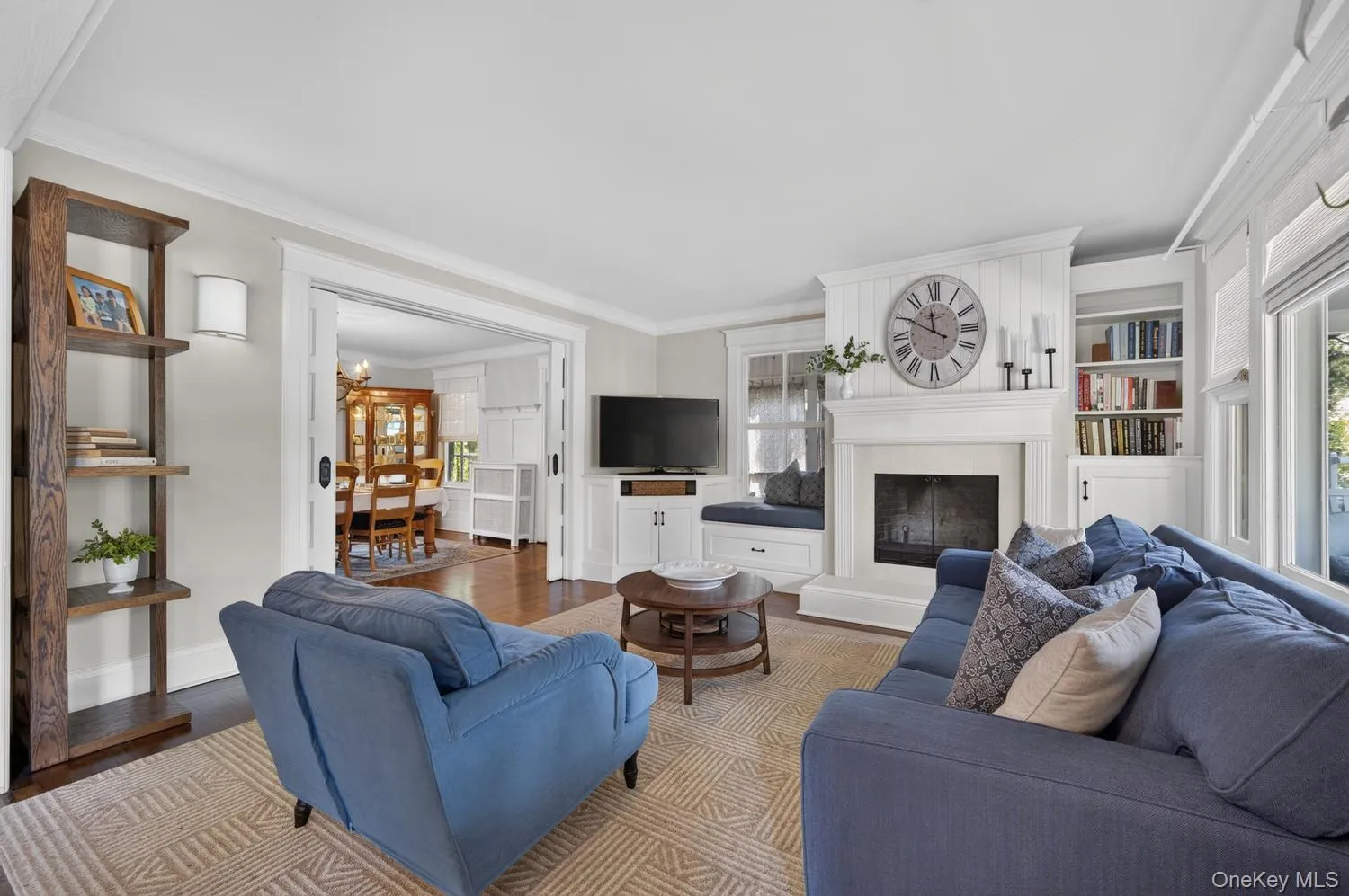 With built-ins, wood burning fire place, and sliding doors to Dining Room. With built-ins, wood burning fire place, and sliding doors to Dining Room.