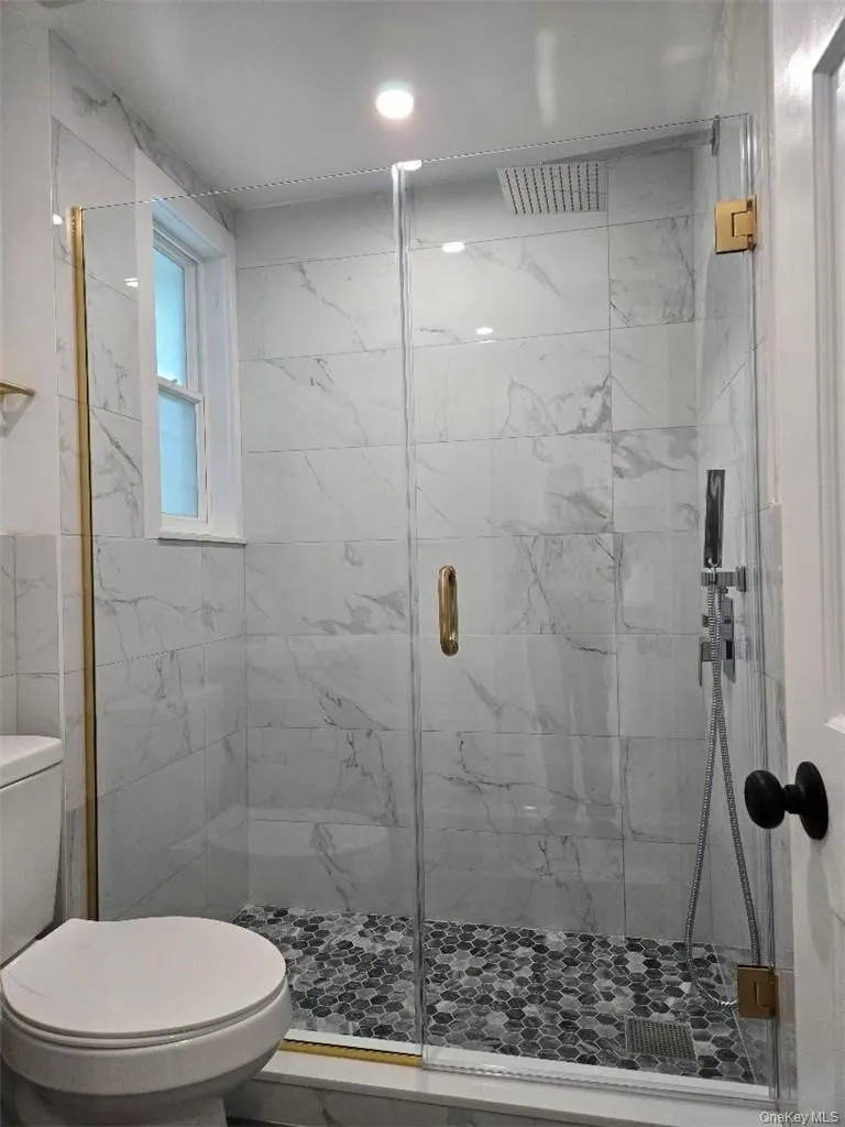 Amazing, Upscale Bathroom with Sumptuous Tiling and Shower stall. Beautiful Light Fixtures. Amazing, Upscale Bathroom with Sumptuous Tiling and Shower stall. Beautiful Light Fixtures.