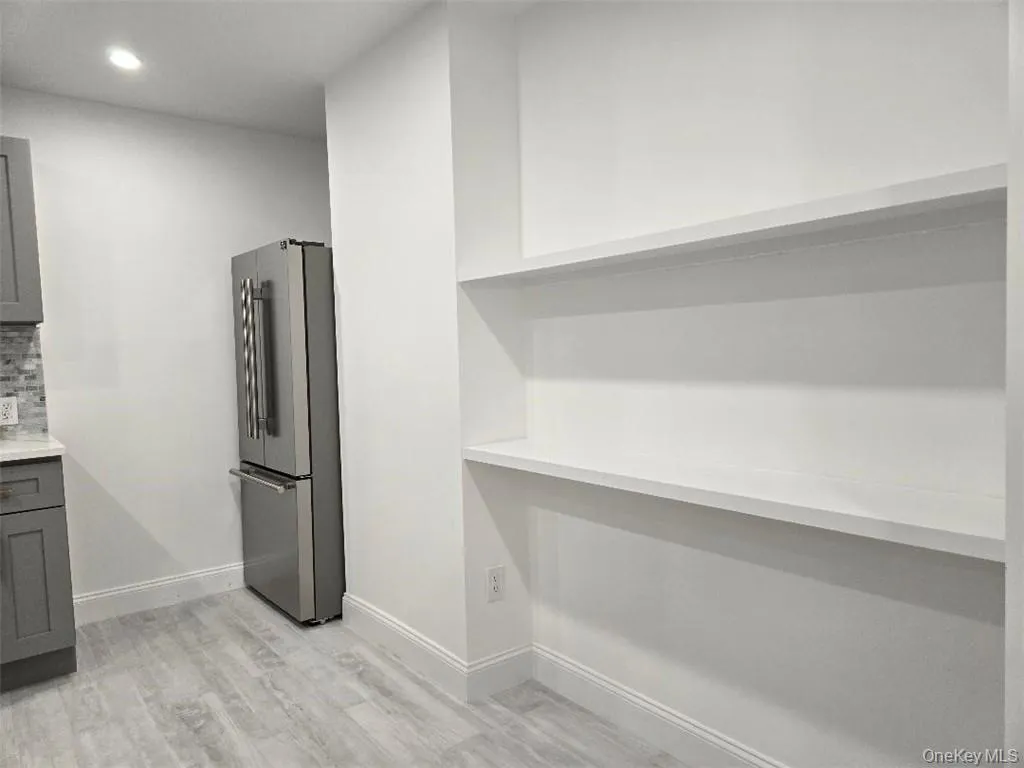 Another View of the Stunning kitchen featuring large pantry shelving. Another View of the Stunning kitchen featuring large pantry shelving.