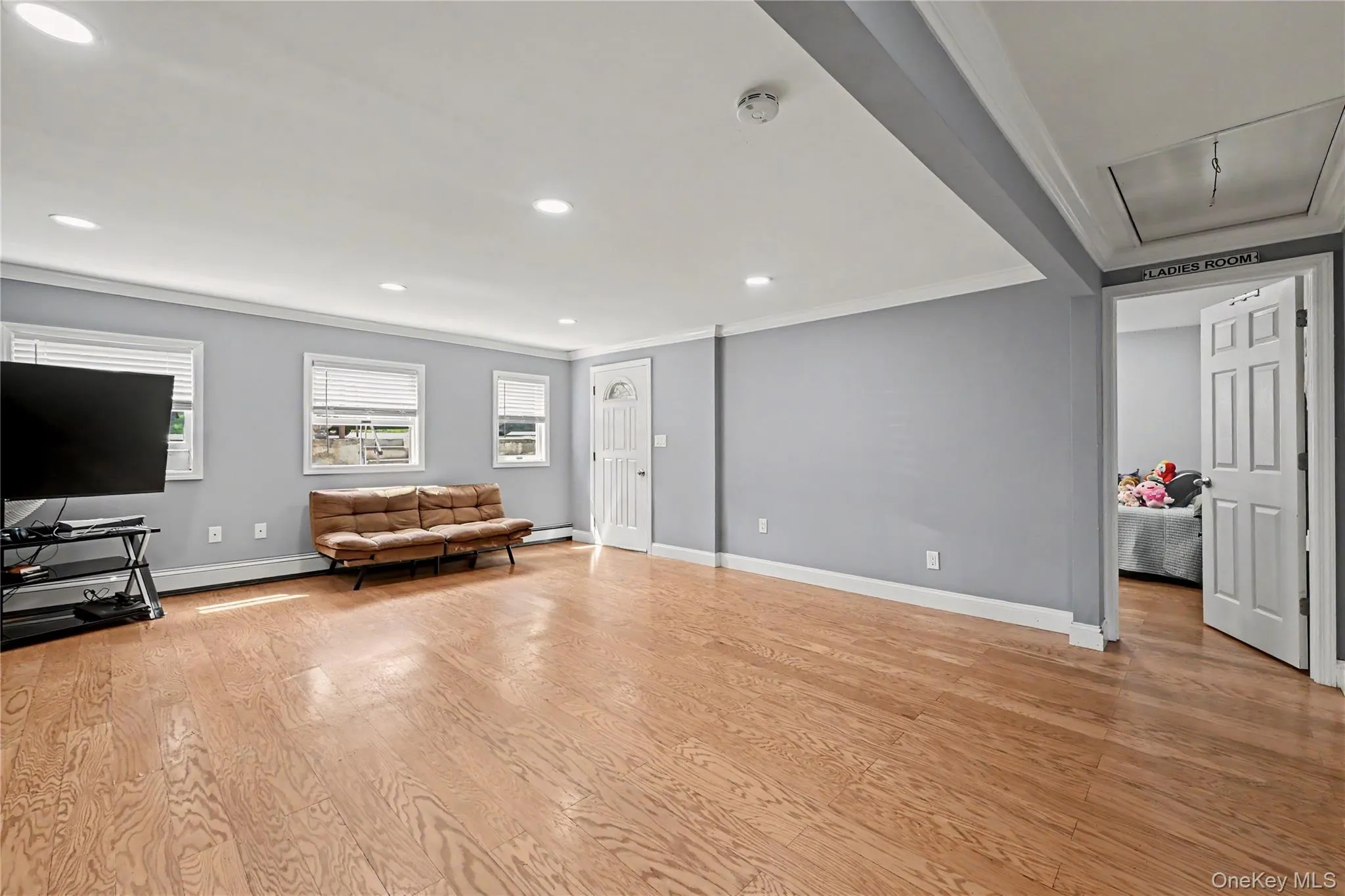 Bright living room with door to bedroom. Bright living room with door to bedroom.