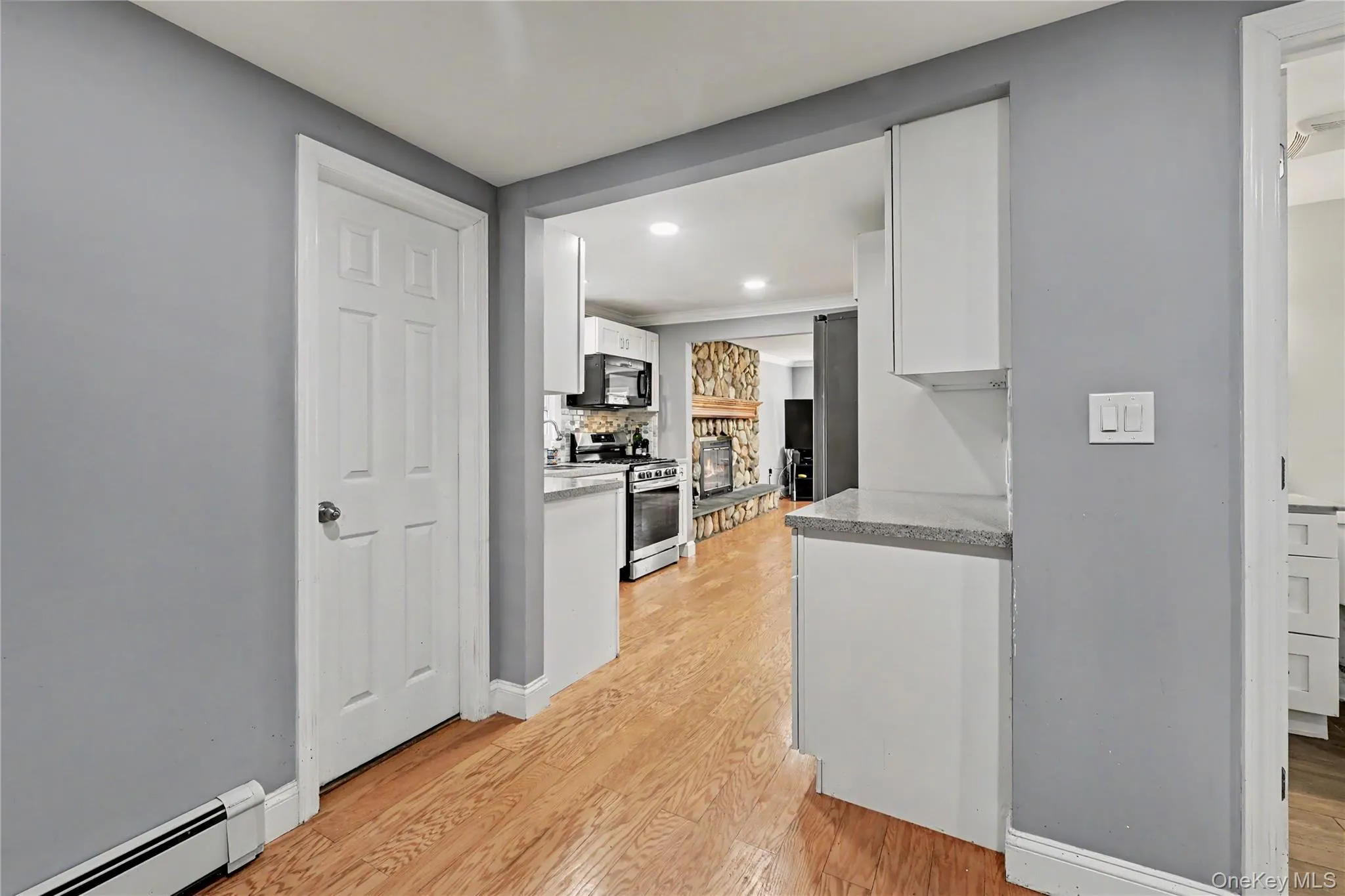 View to kitchen with door to lower level. View to kitchen with door to lower level.