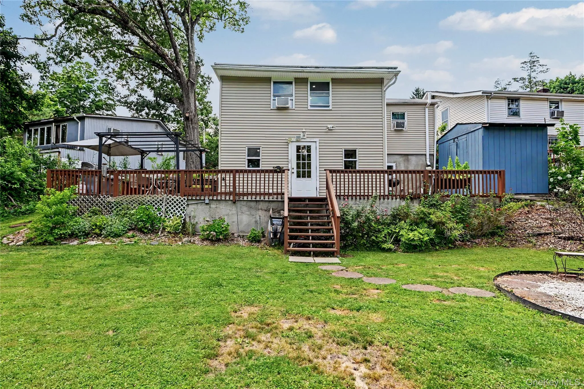 Back of home and large deck. Back of home and large deck.
