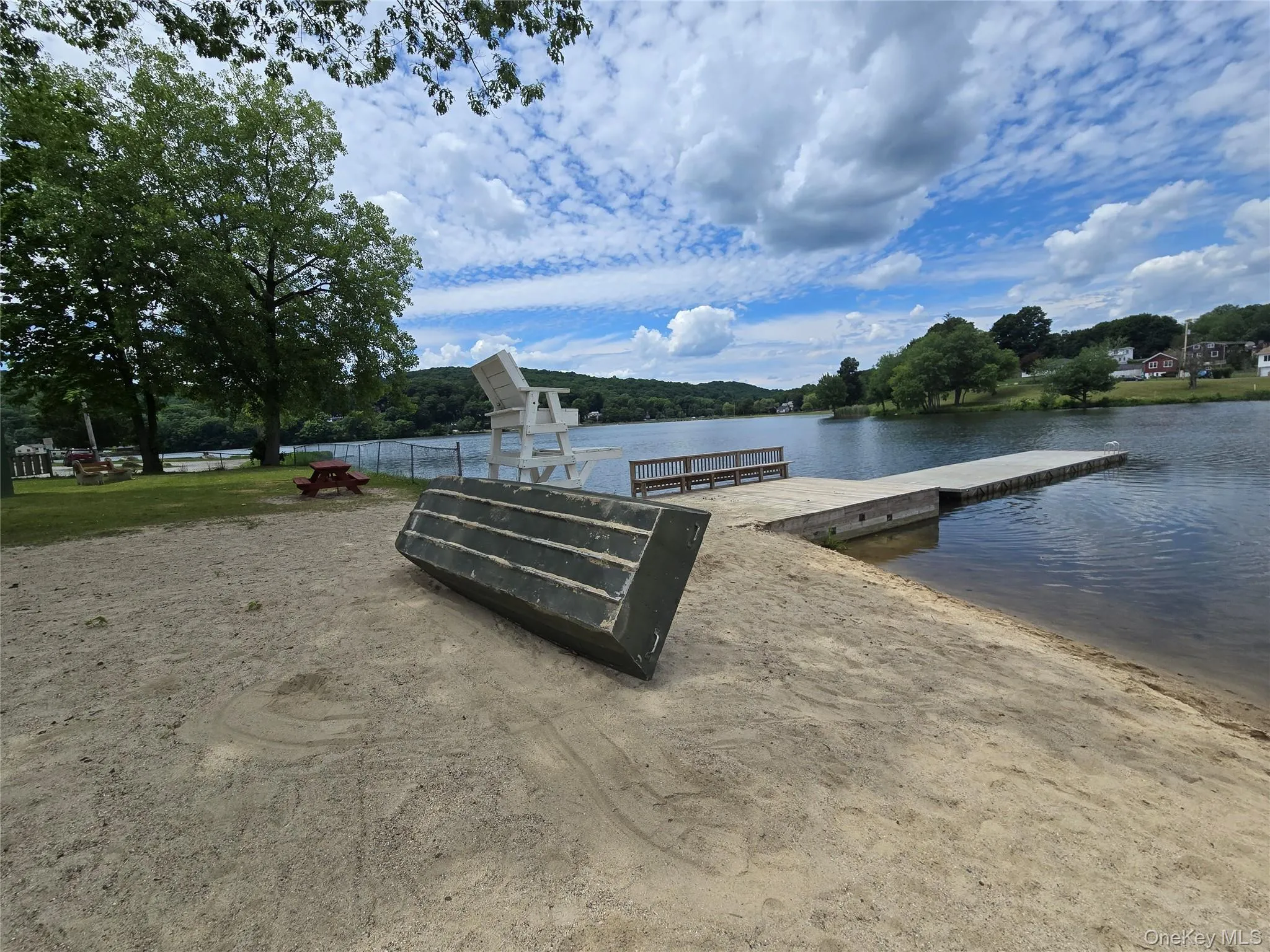 Pristine sand beach and dock. Pristine sand beach and dock.