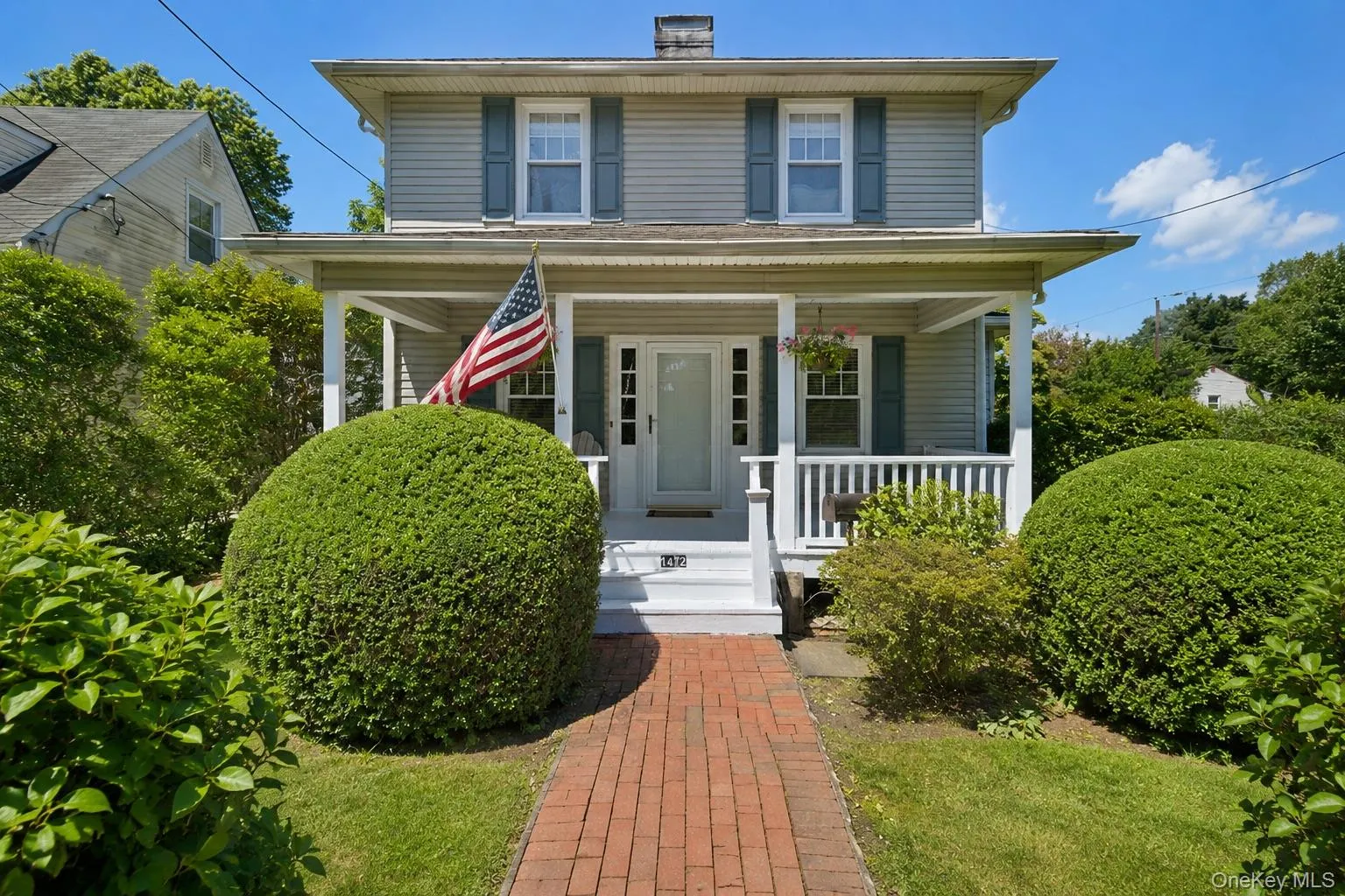 Two-story residence featuring welcoming covered front porch Two-story residence featuring welcoming covered front porch
