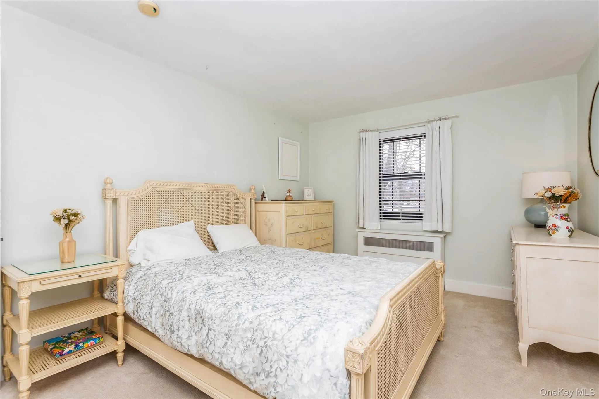 Bedroom featuring light colored carpet Bedroom featuring light colored carpet