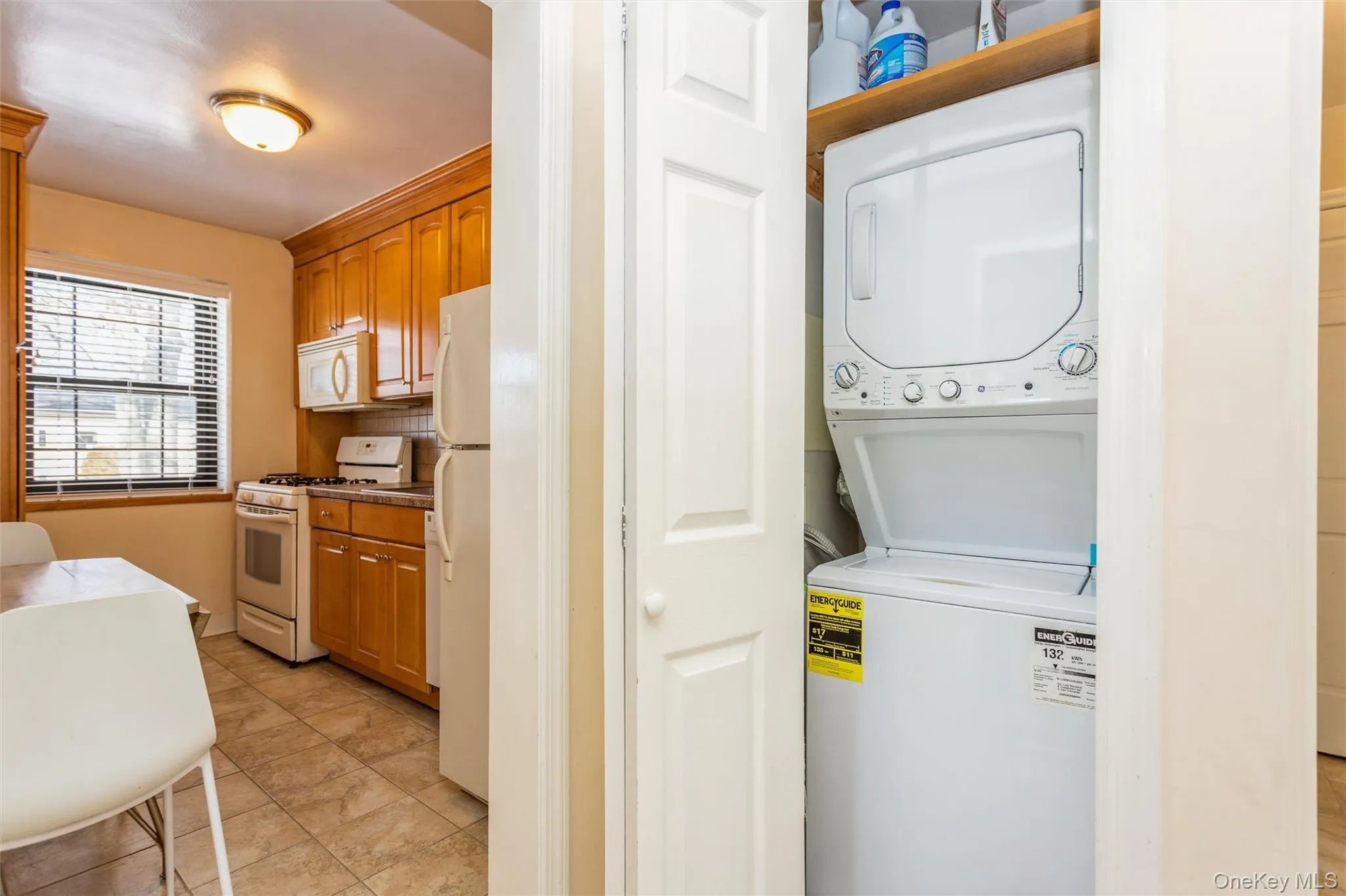 Laundry room featuring stacked washer and clothes dryer Laundry room featuring stacked washer and clothes dryer