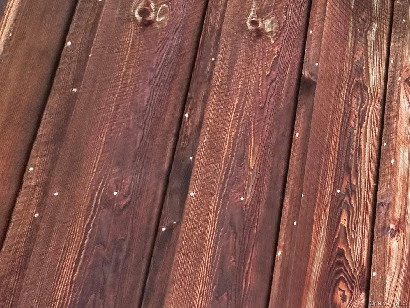 Close-up detail of the board-and-batten hemlock siding showcasing the home’s rustic Catskills craftsmanship and character. Close-up detail of the board-and-batten hemlock siding showcasing the home’s rustic Catskills craftsmanship and character.