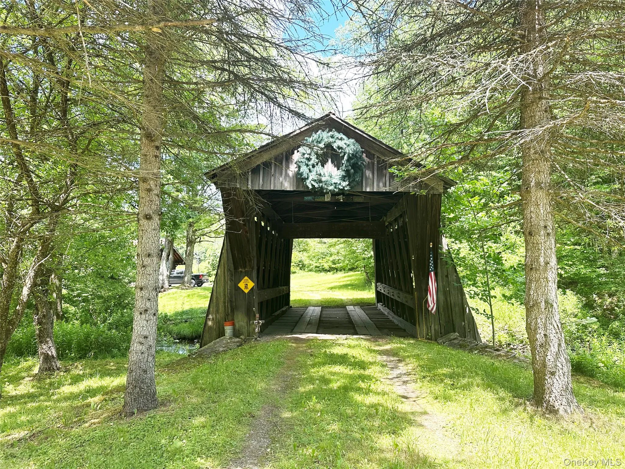 Historic Campbell Covered Bridge entrance included with the property, creating a truly one-of-a-kind arrival experience in the heart of the Catskills. Historic Campbell Covered Bridge entrance included with the property, creating a truly one-of-a-kind arrival experience in the heart of the Catskills.