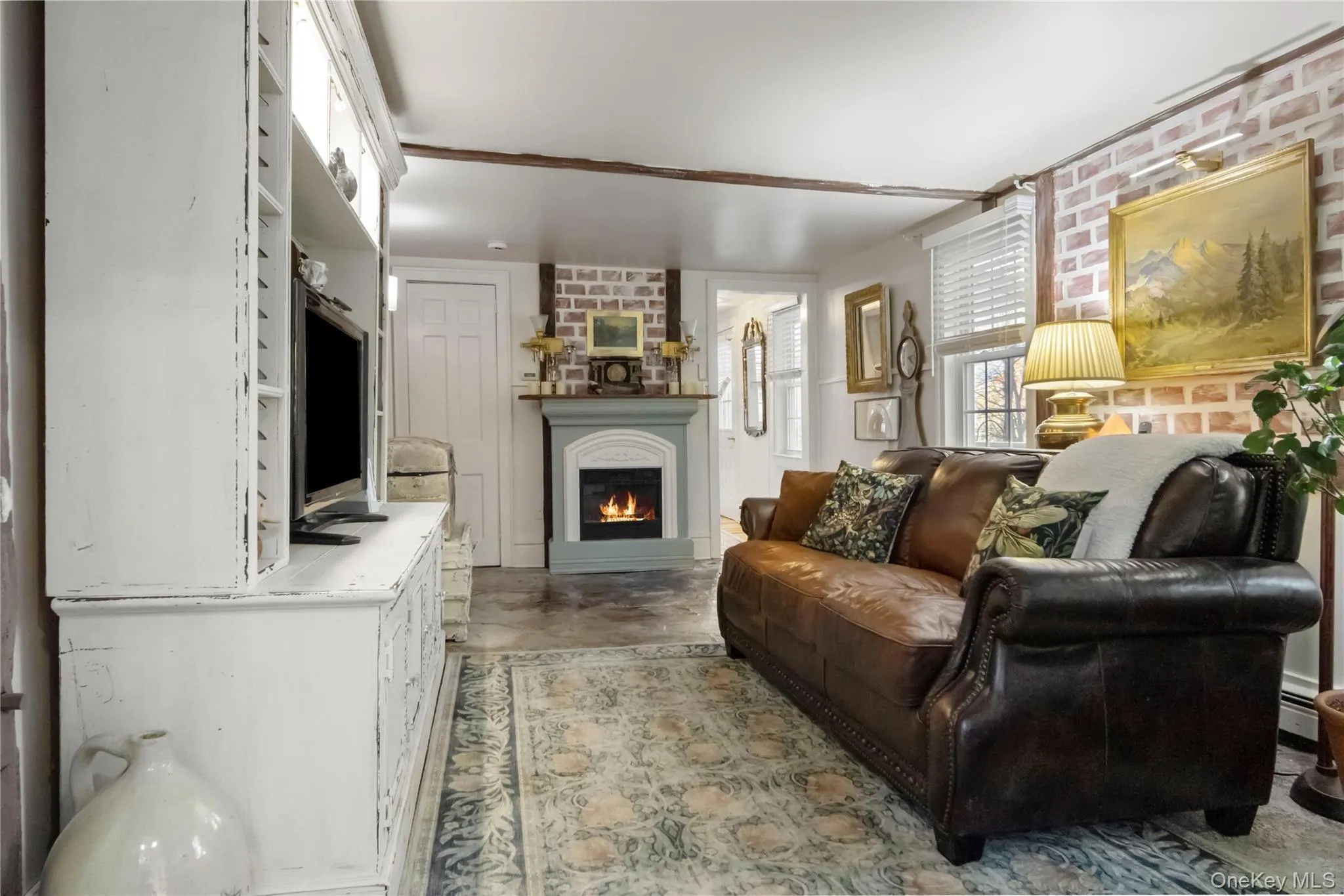 Family/Sitting Room with built in wall unit and propane fireplace Family/Sitting Room with built in wall unit and propane fireplace