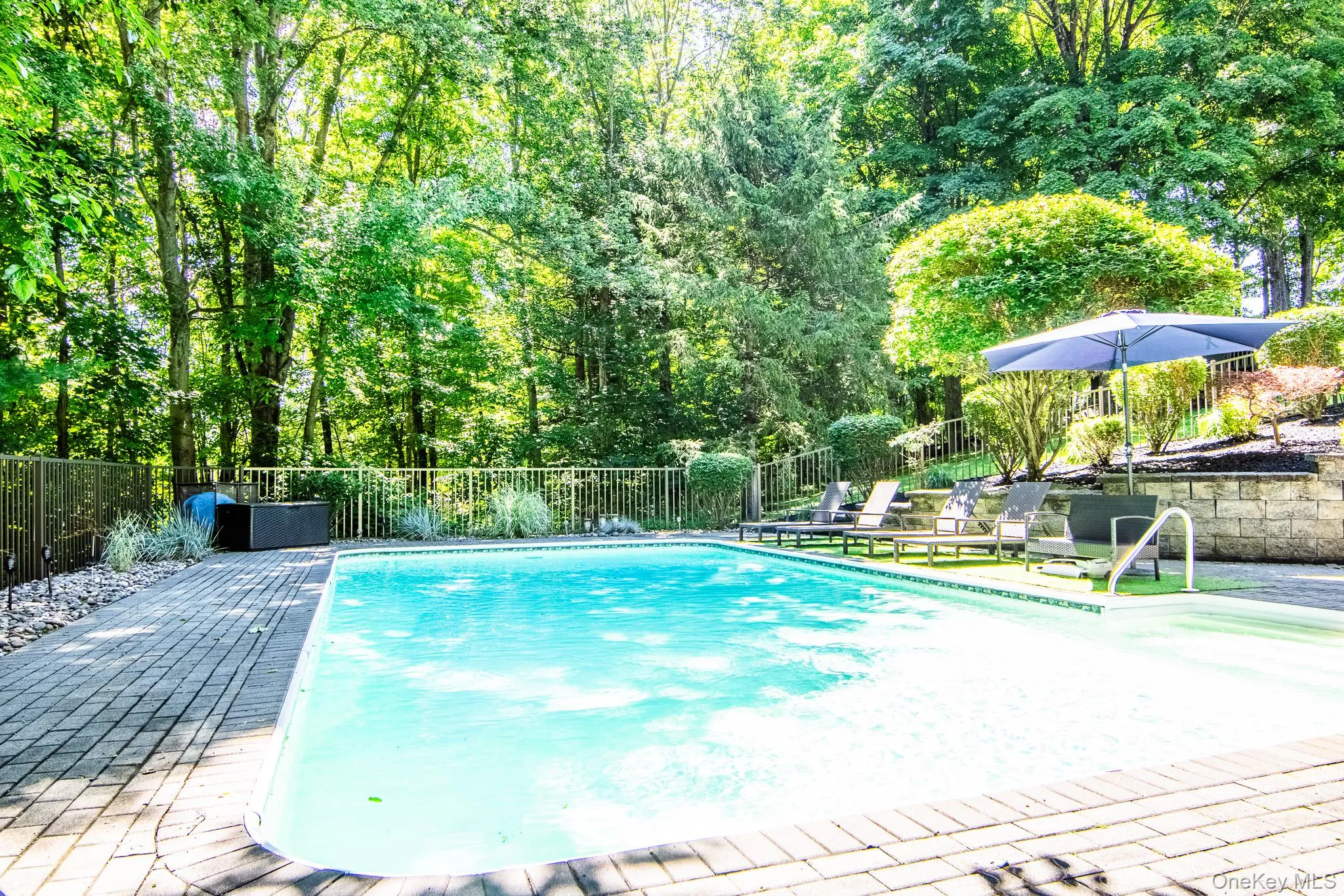 Pool is surrounded by mature trees providing privacy Pool is surrounded by mature trees providing privacy