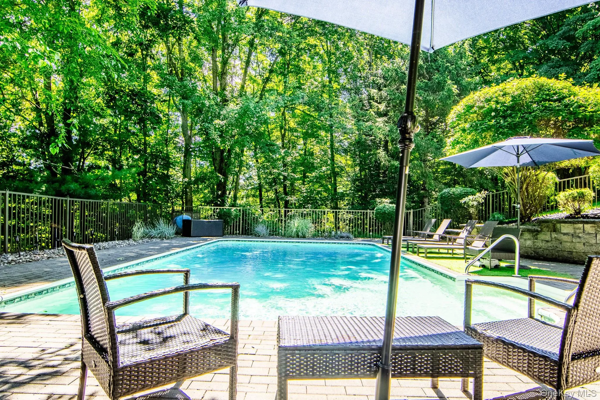 Pool is surrounded by mature trees providing privacy Pool is surrounded by mature trees providing privacy