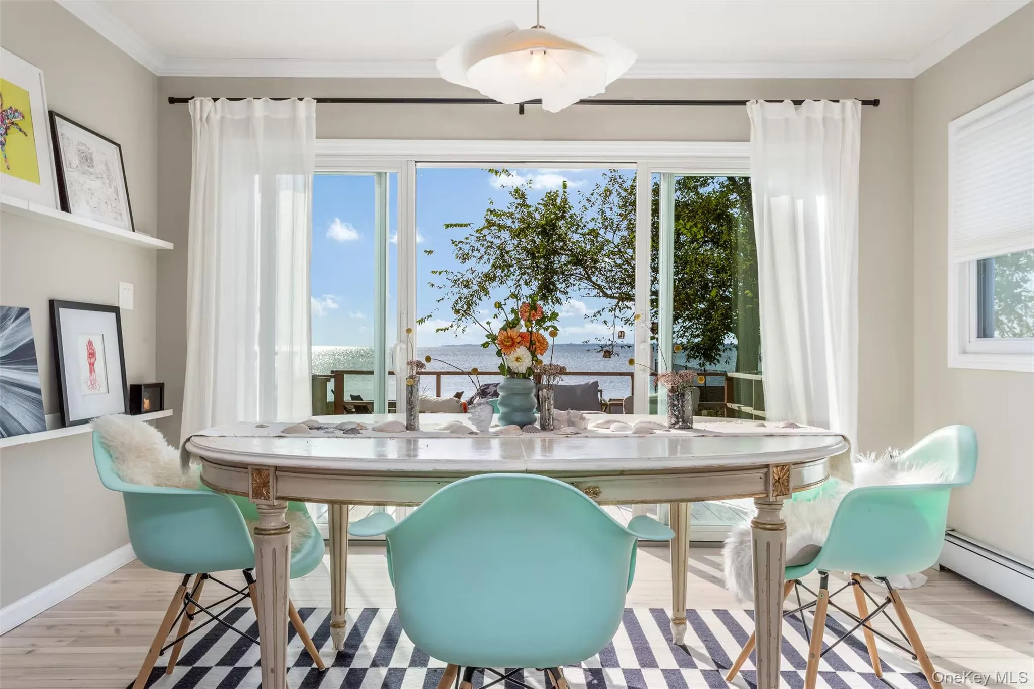 Waterfront Dining Room with three panel slider Waterfront Dining Room with three panel slider
