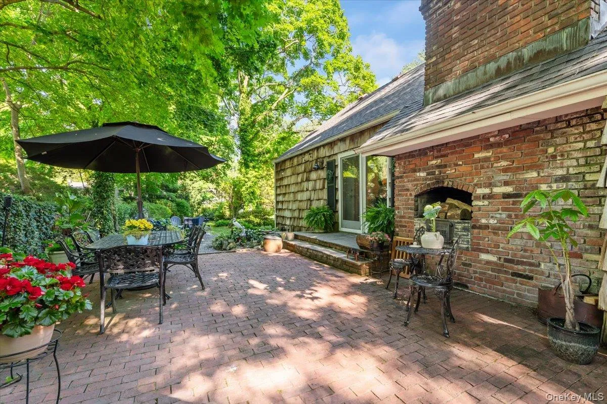 Brick patio featuring a built-in outdoor fireplace Brick patio featuring a built-in outdoor fireplace