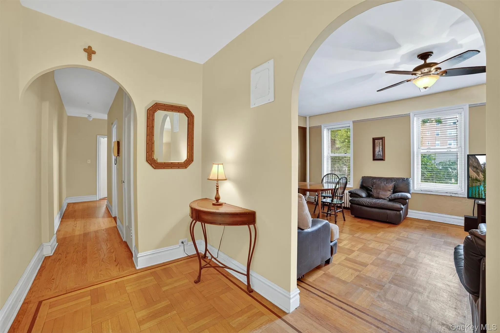 Hallway with arched walkways and parquet floors Hallway with arched walkways and parquet floors