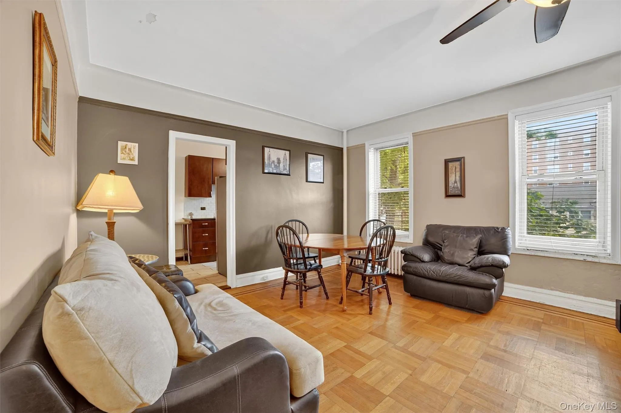 Living room with ceiling fan and baseboards Living room with ceiling fan and baseboards