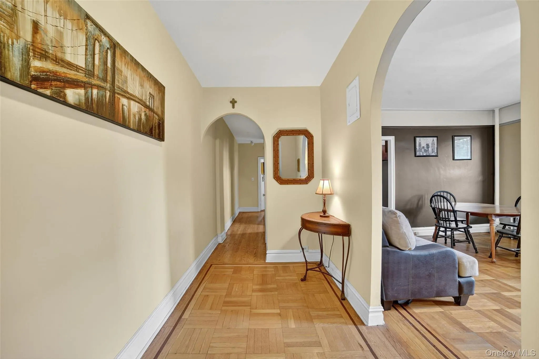 Hall with arched walkways and baseboards Hall with arched walkways and baseboards