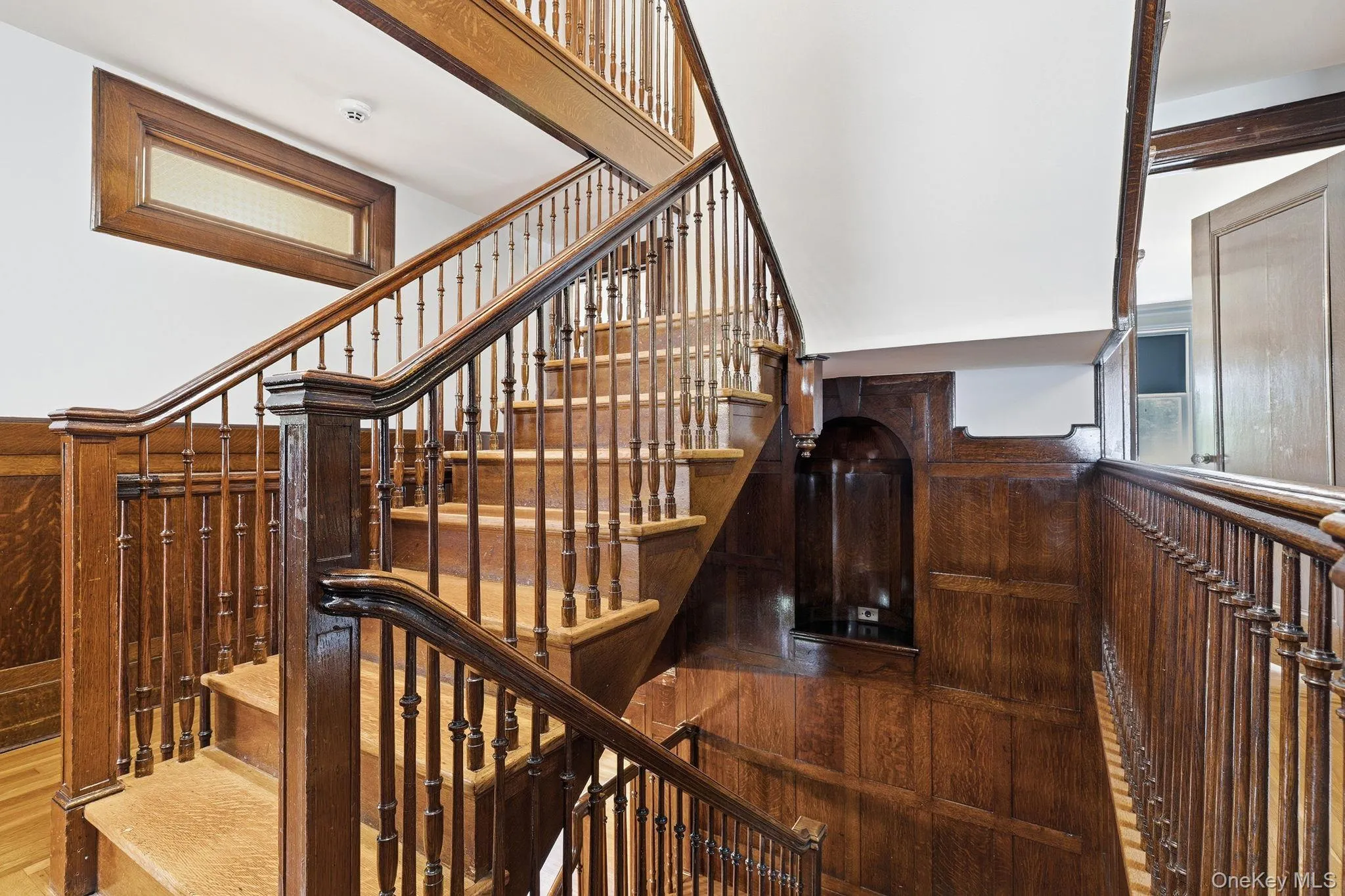 A magnificent staircase gracefully connecting three levels of timeless living. A magnificent staircase gracefully connecting three levels of timeless living.