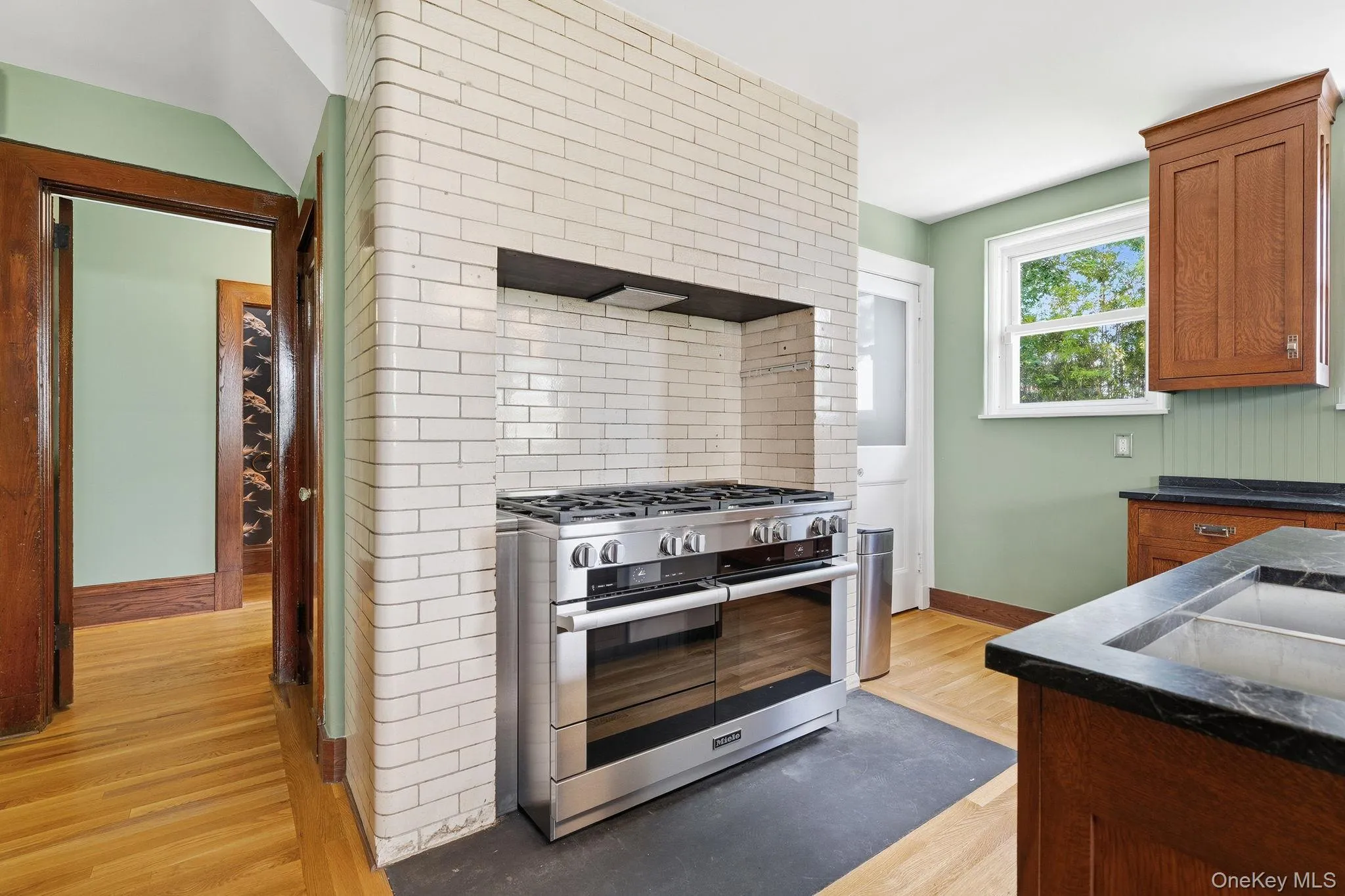 A kitchen that invites conversation as much as cooking. A kitchen that invites conversation as much as cooking.