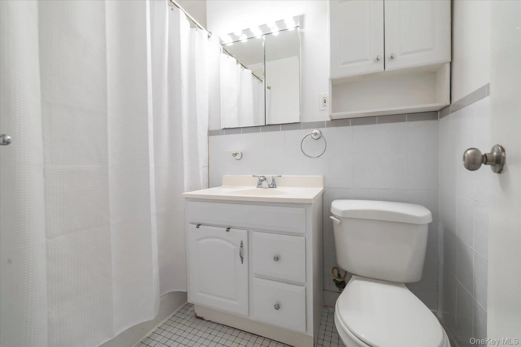Bathroom with tiled flooring Bathroom with tiled flooring
