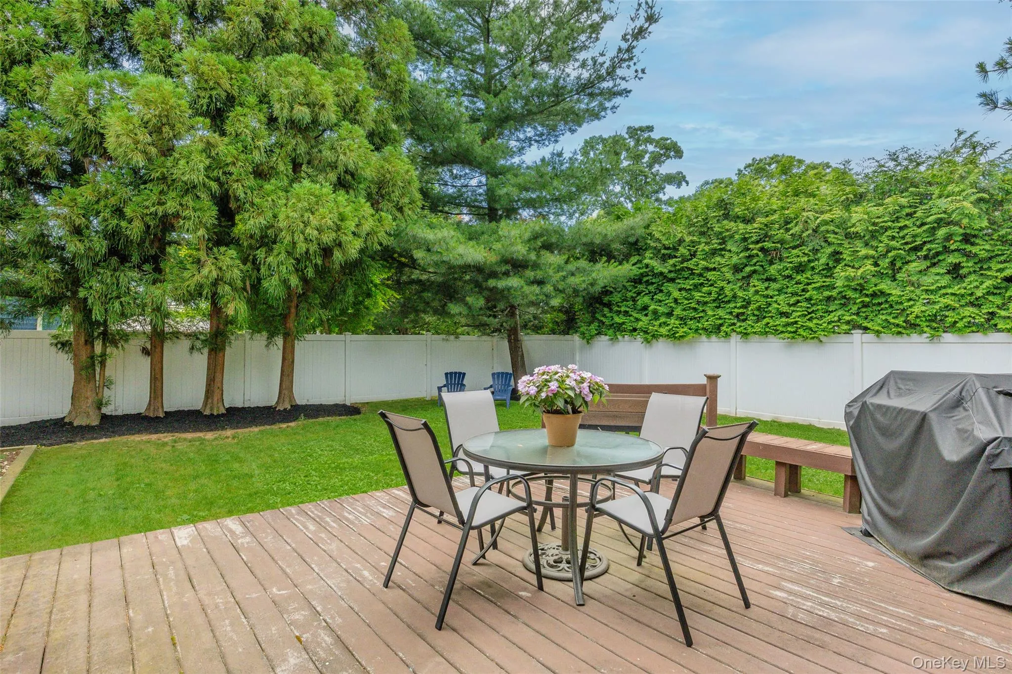 Wood deck off the sliders in den set right in the private yard Wood deck off the sliders in den set right in the private yard