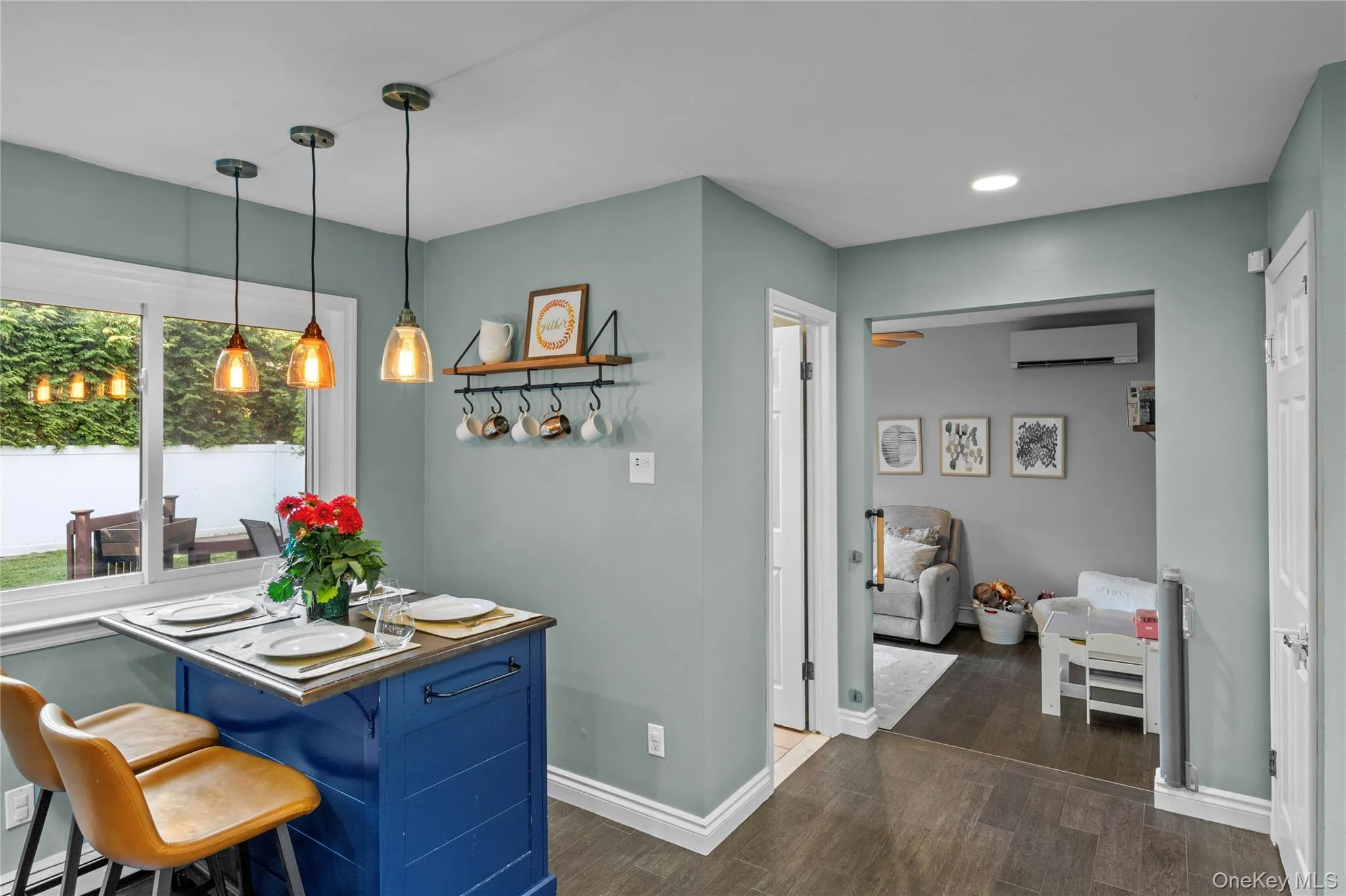 Kitchen featuring removeable island eating area, access to half bath and den Kitchen featuring removeable island eating area, access to half bath and den