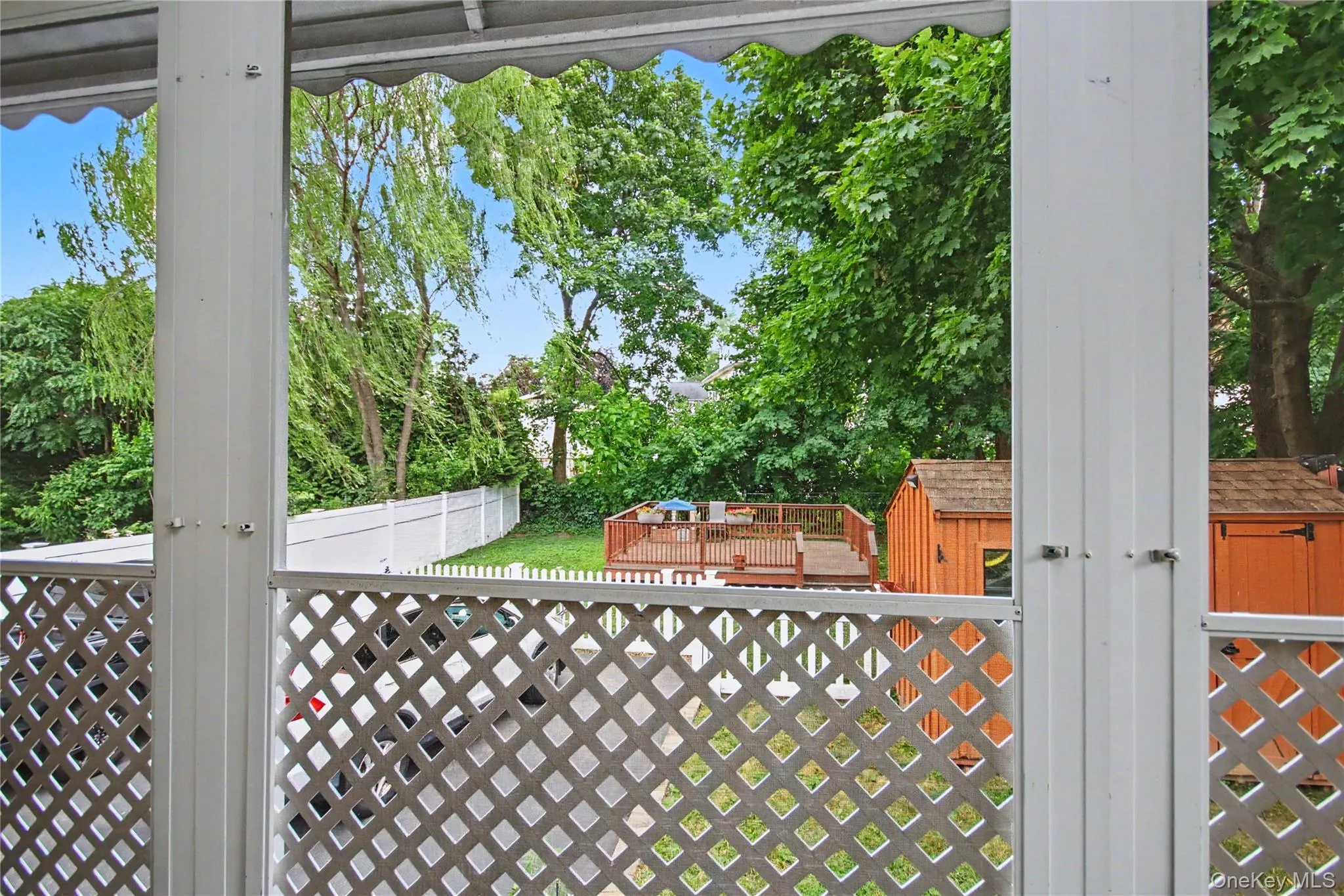 Screened-in back porch with door to private back yard. Screened-in back porch with door to private back yard.