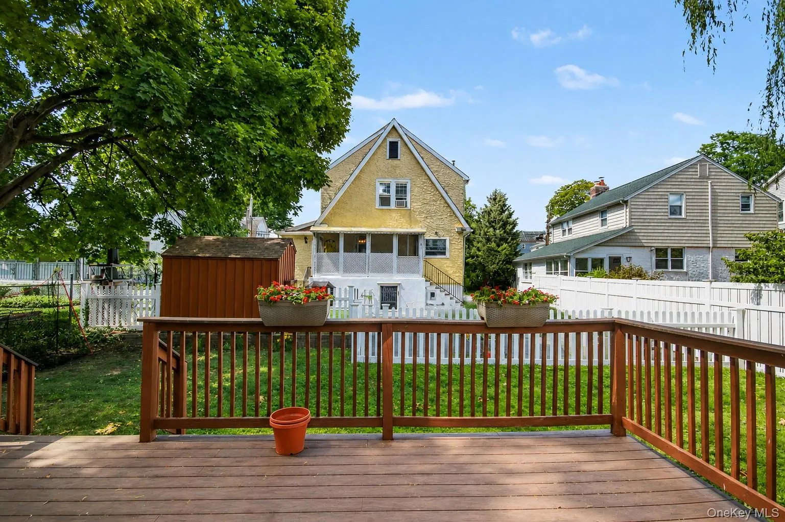Private backyard and large wood deck. Private backyard and large wood deck.