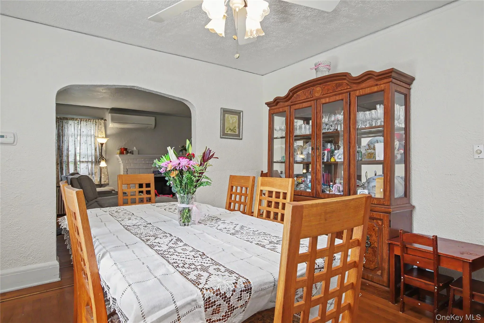 Formal dining room with architectural arch into living room. Formal dining room with architectural arch into living room.