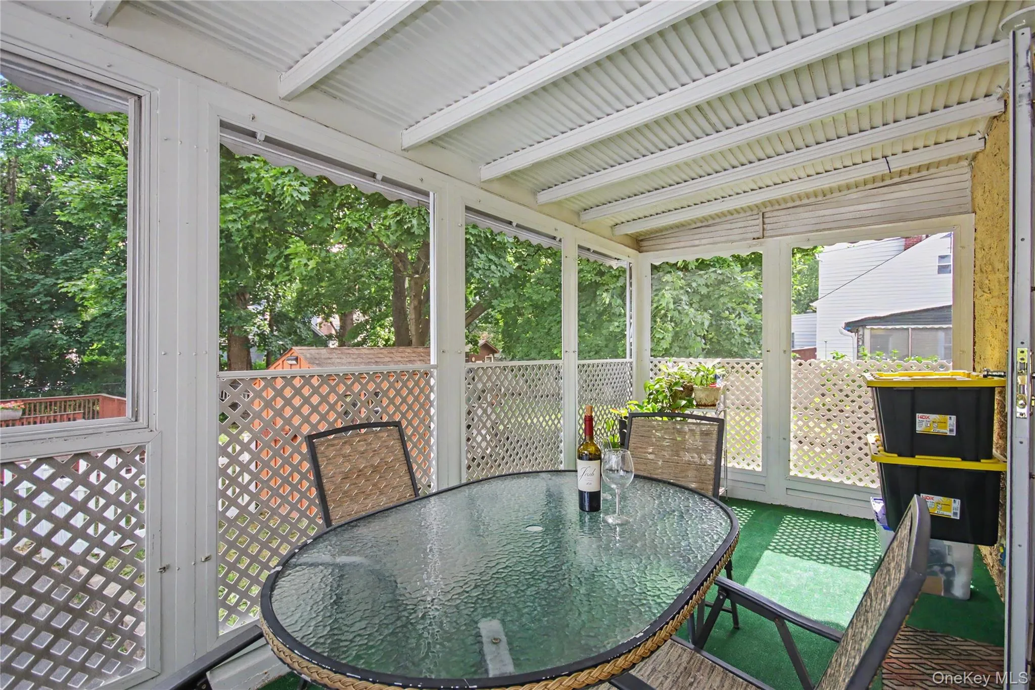 Screened-in back porch with door to private back yard. Screened-in back porch with door to private back yard.