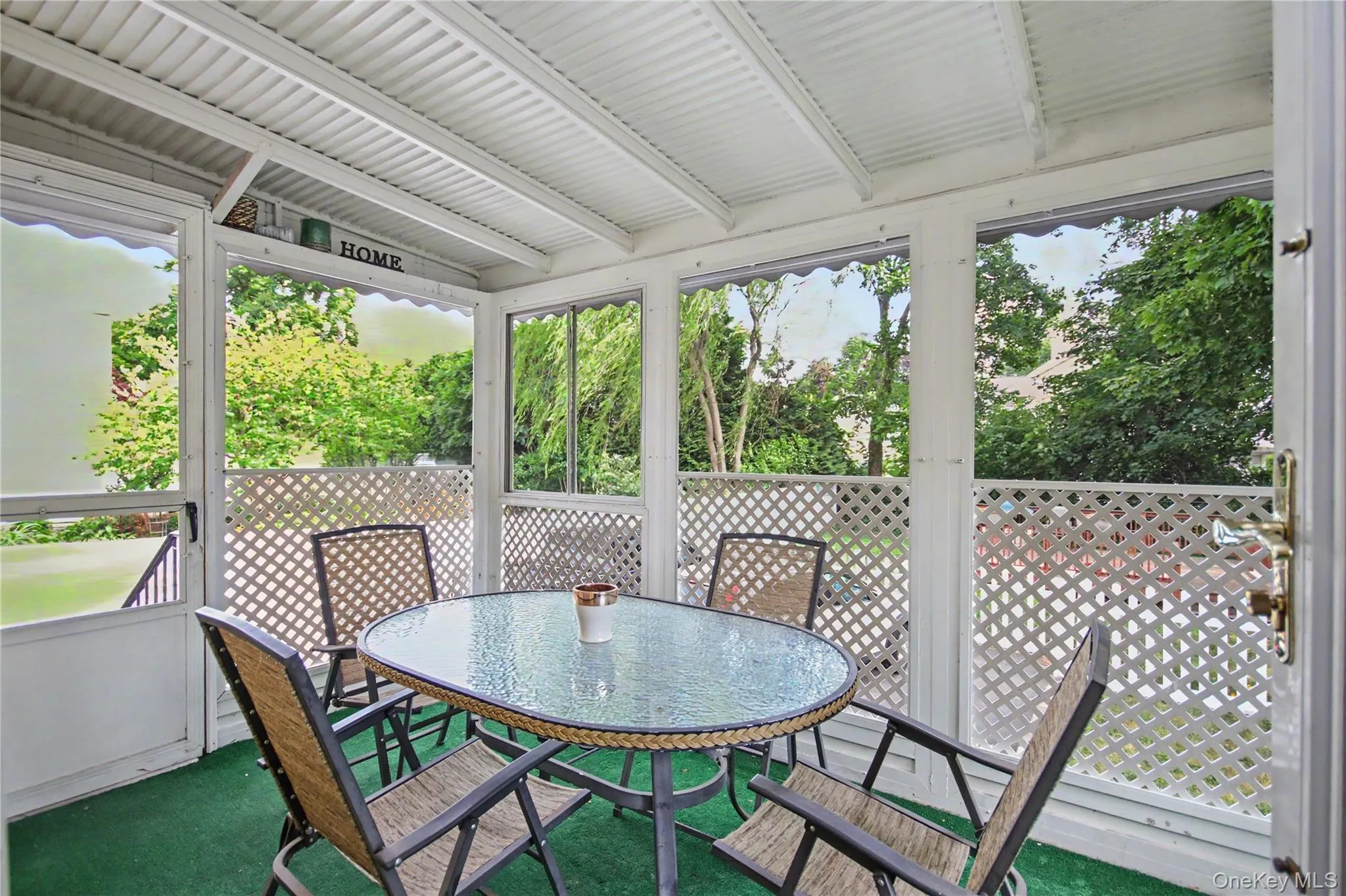 Screened-in back porch easily accessible from dining room. Screened-in back porch easily accessible from dining room.