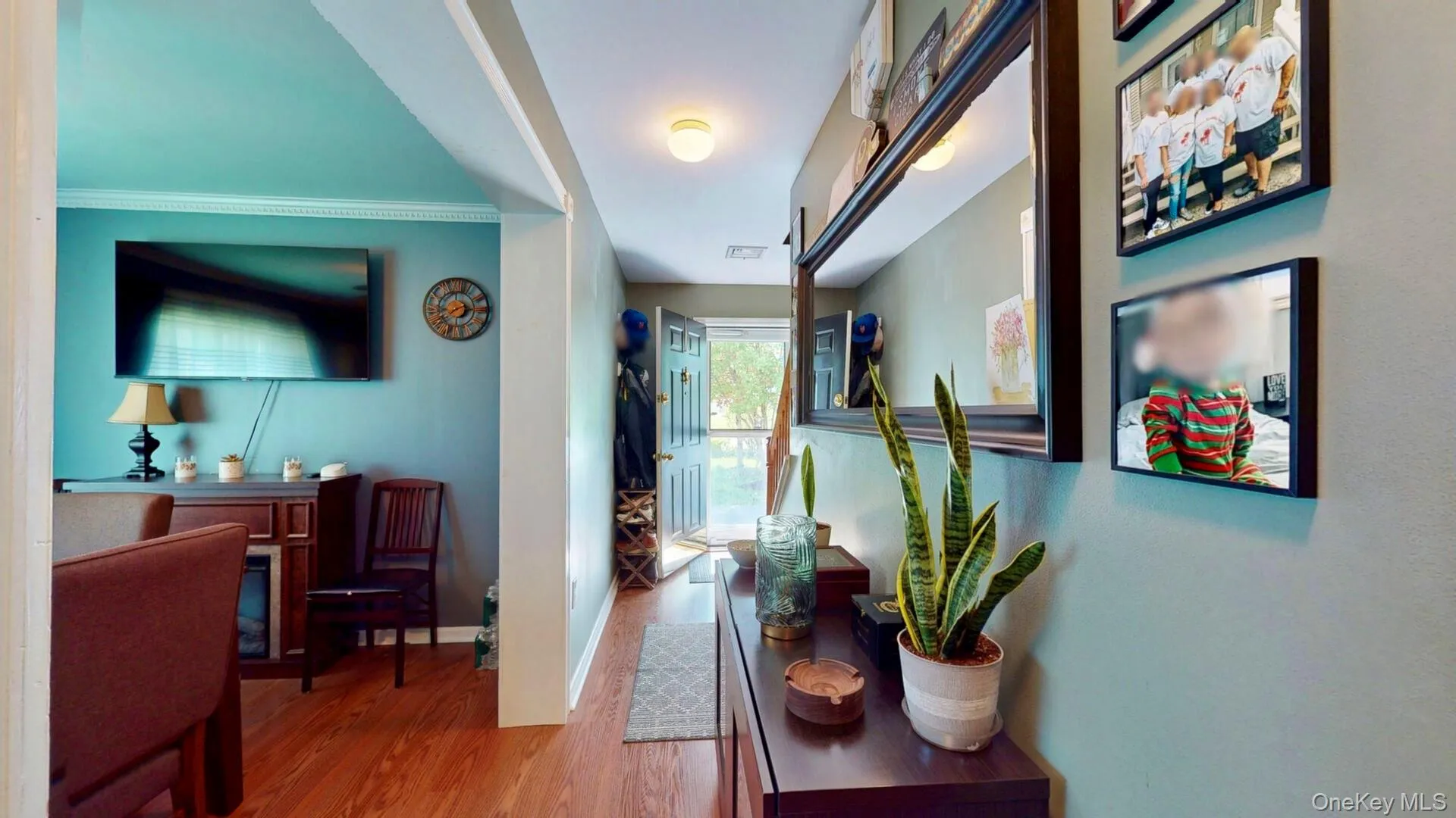 Hallway featuring wood finished floors and baseboards Hallway featuring wood finished floors and baseboards