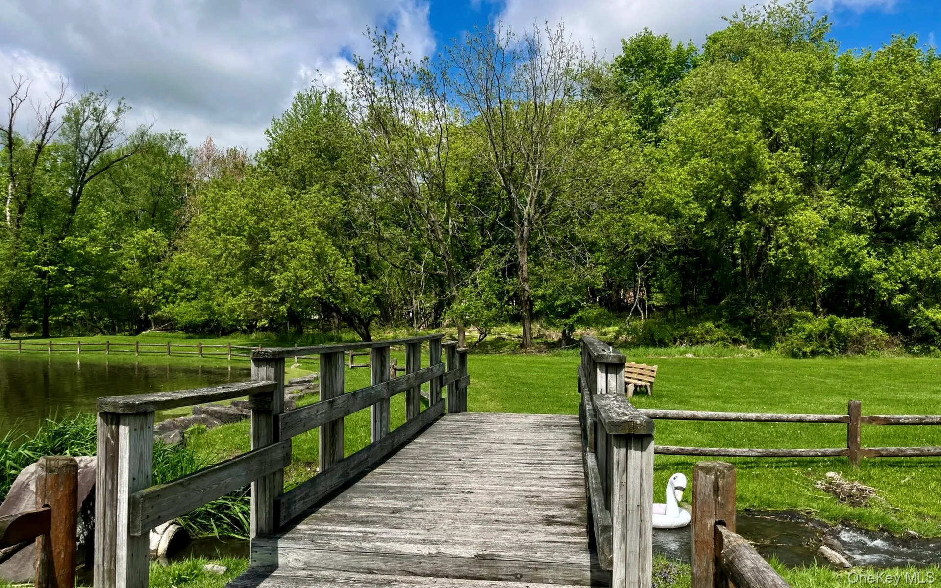 Dock area featuring a yard and a water view Dock area featuring a yard and a water view