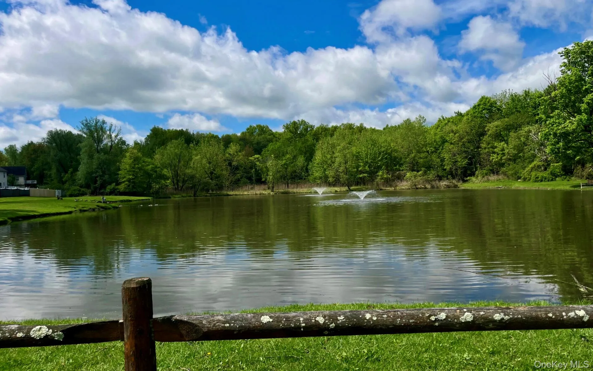 Water view featuring a forest Water view featuring a forest