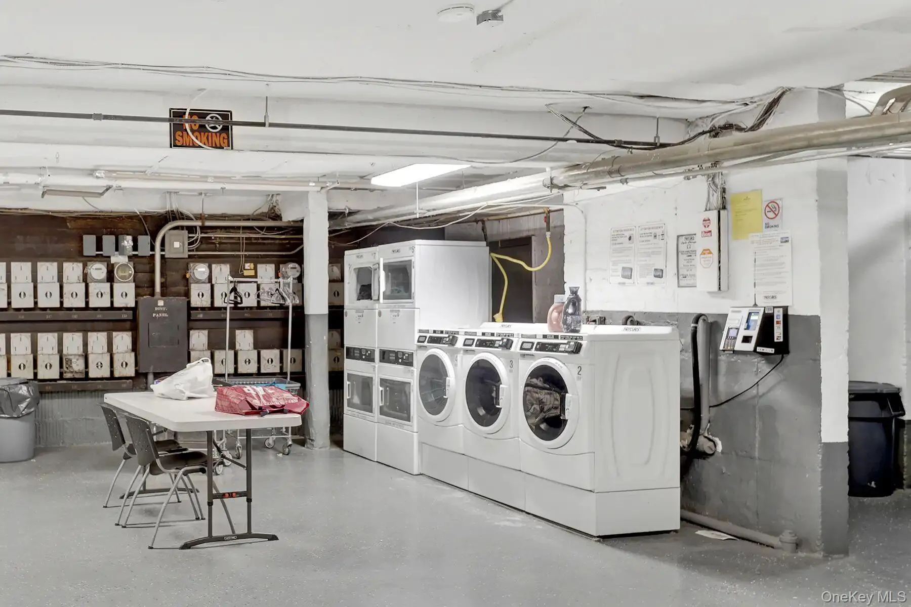 On-site laundry facility featuring multiple front-loading washers and dryers On-site laundry facility featuring multiple front-loading washers and dryers