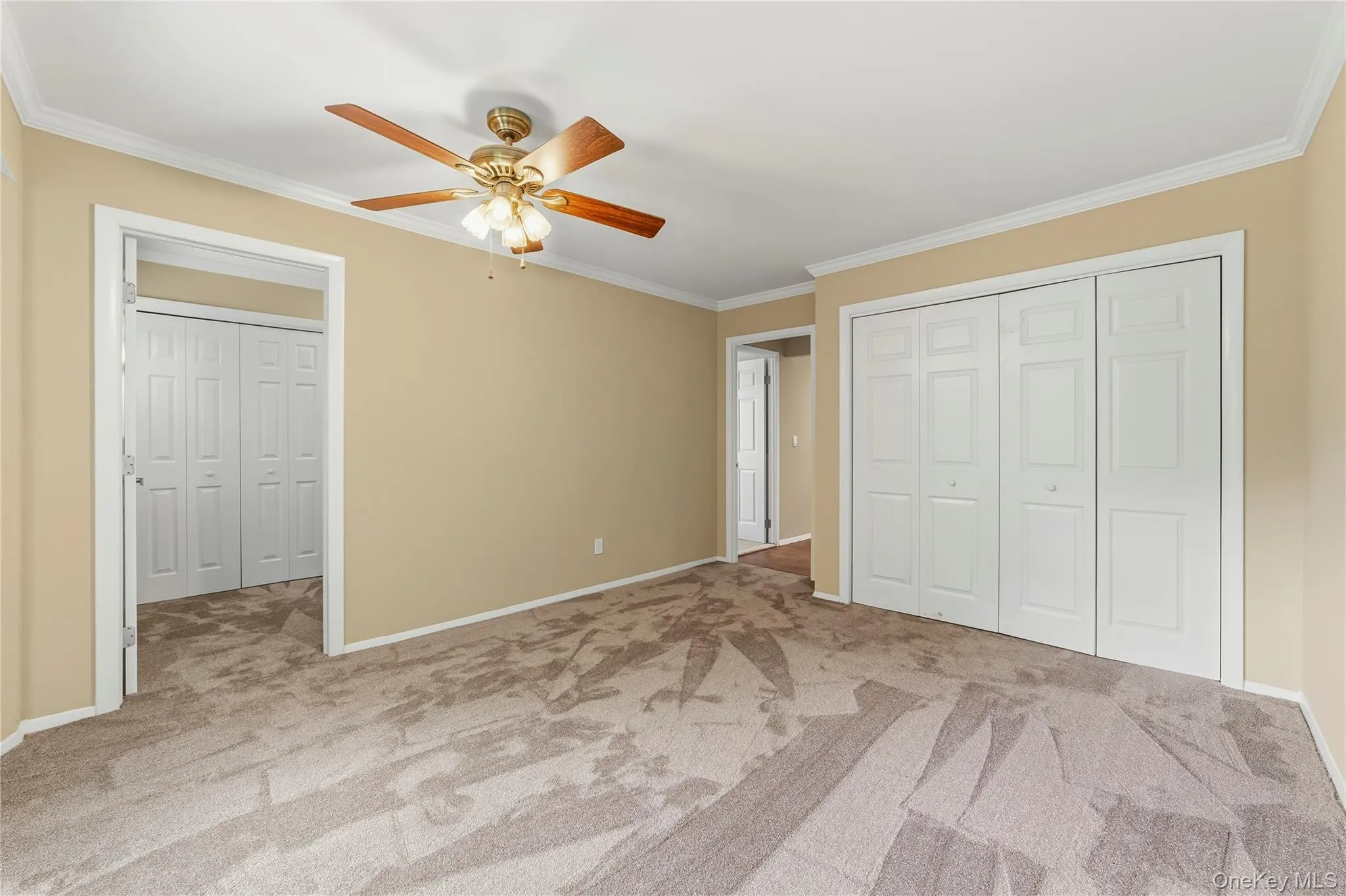 Double door closet, new ceiling fan and new rug. Double door closet, new ceiling fan and new rug.